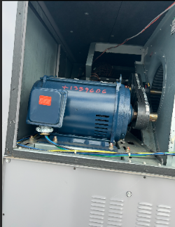 Industrial motor inside a metallic enclosure.