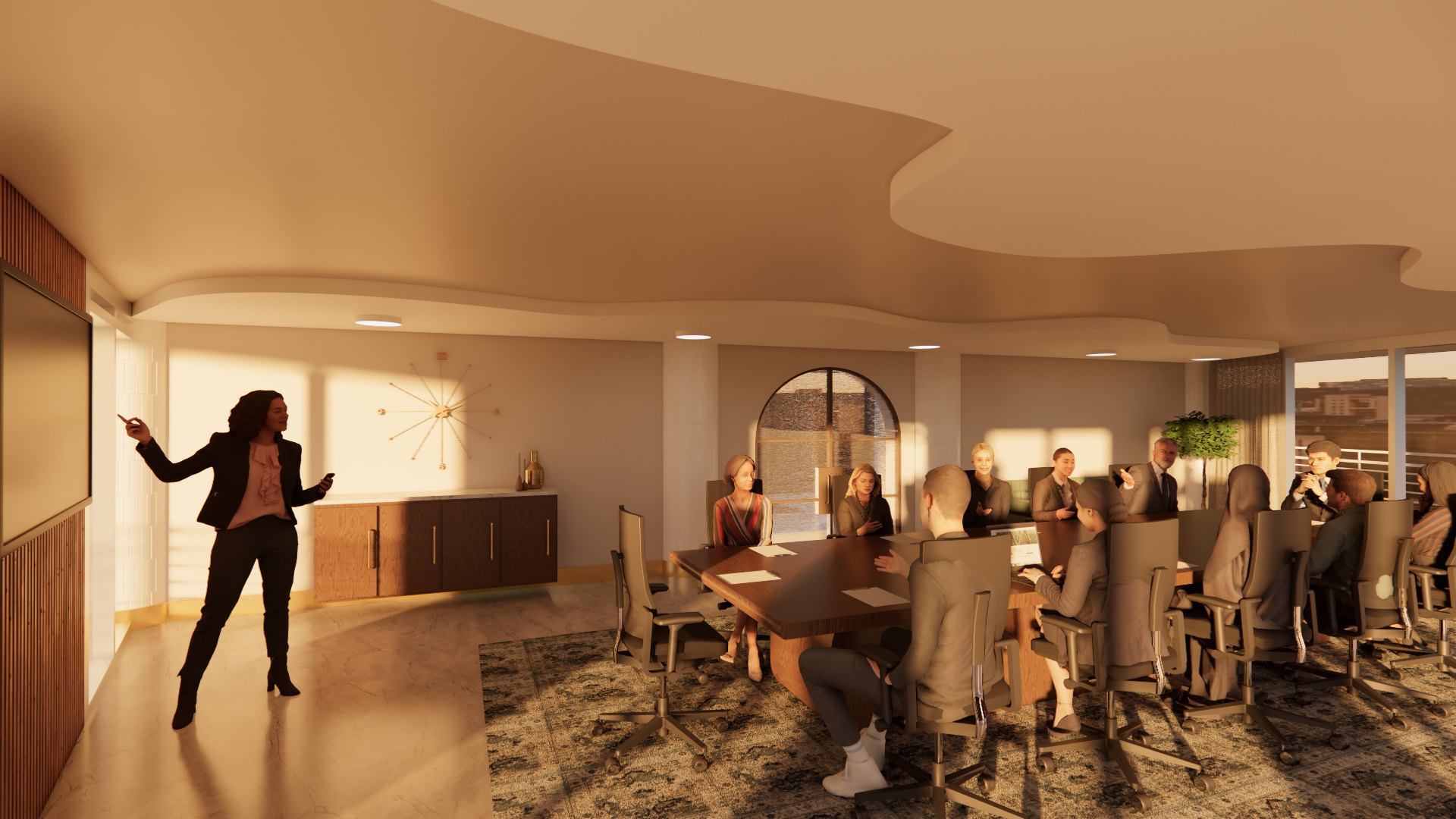 A woman giving a presentation to a conference room filled with attendees seated around a long conference table in a modern office setting.