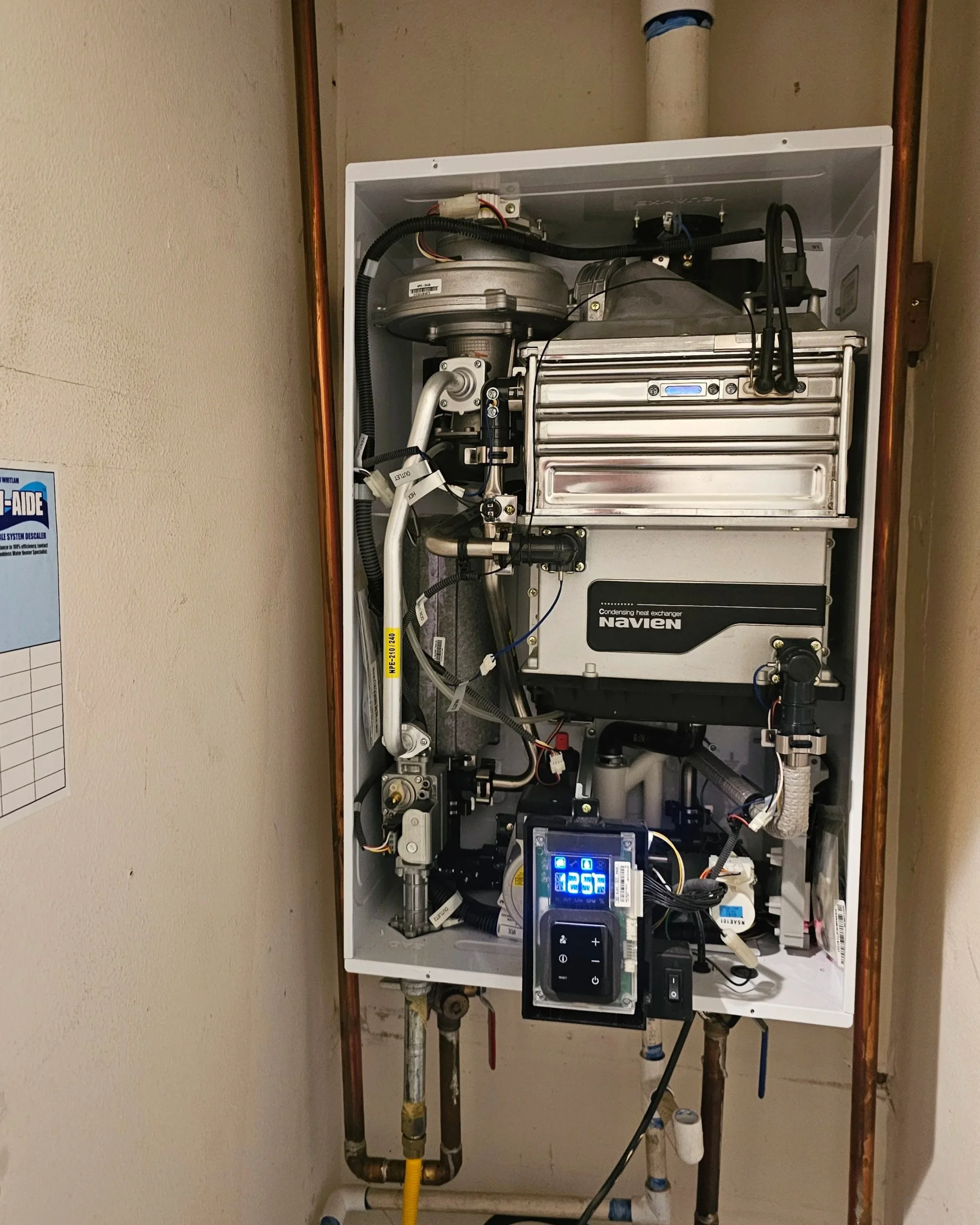 Tankless water heater system serviced and descaled by Emerald Systems, improving efficiency and extending lifespan for homeowners in the East Bay area.