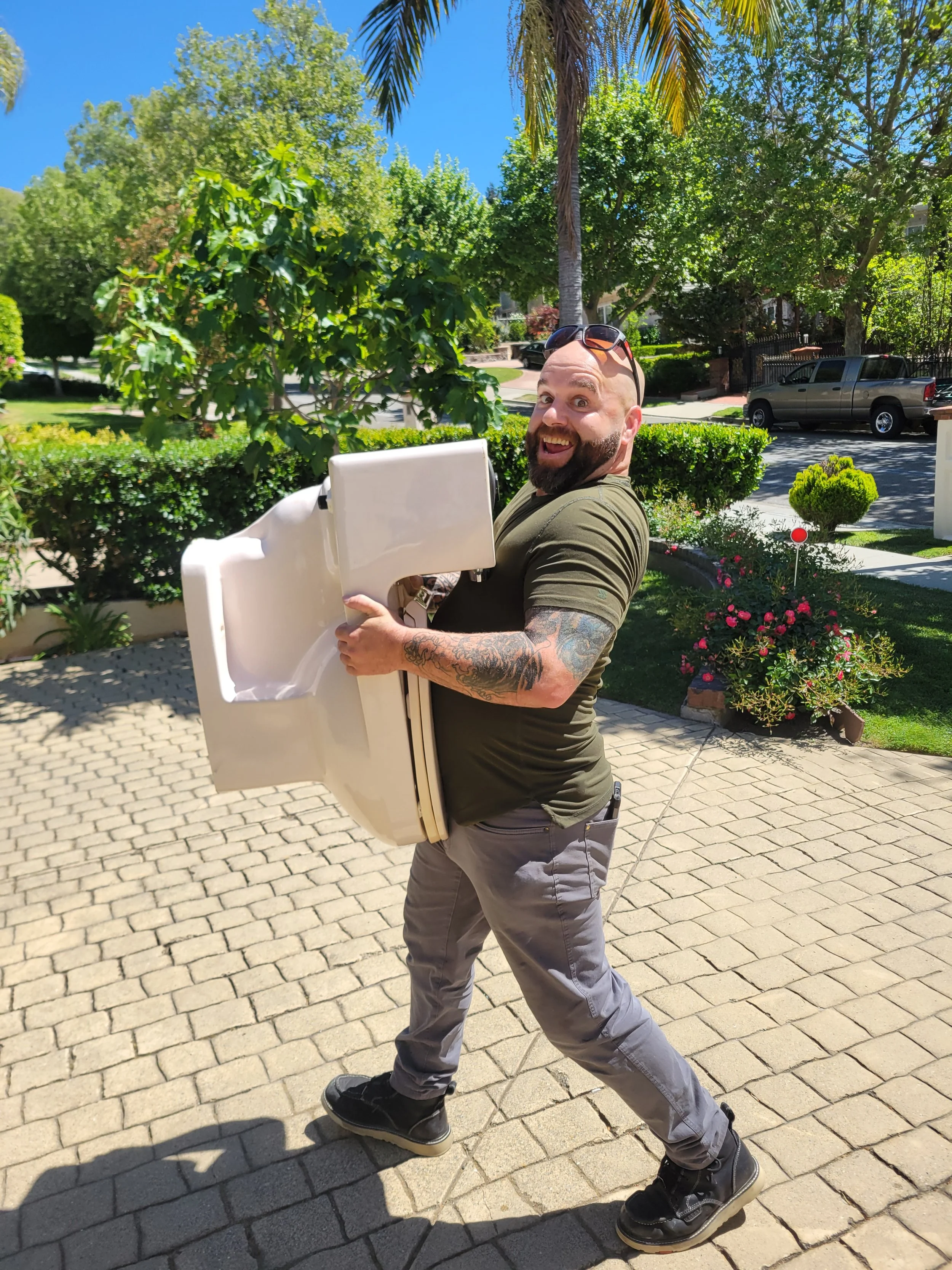 Daniel Davis of Emerald Systems preparing for a toilet installation service, providing reliable plumbing solutions for homeowners in the East Bay area.