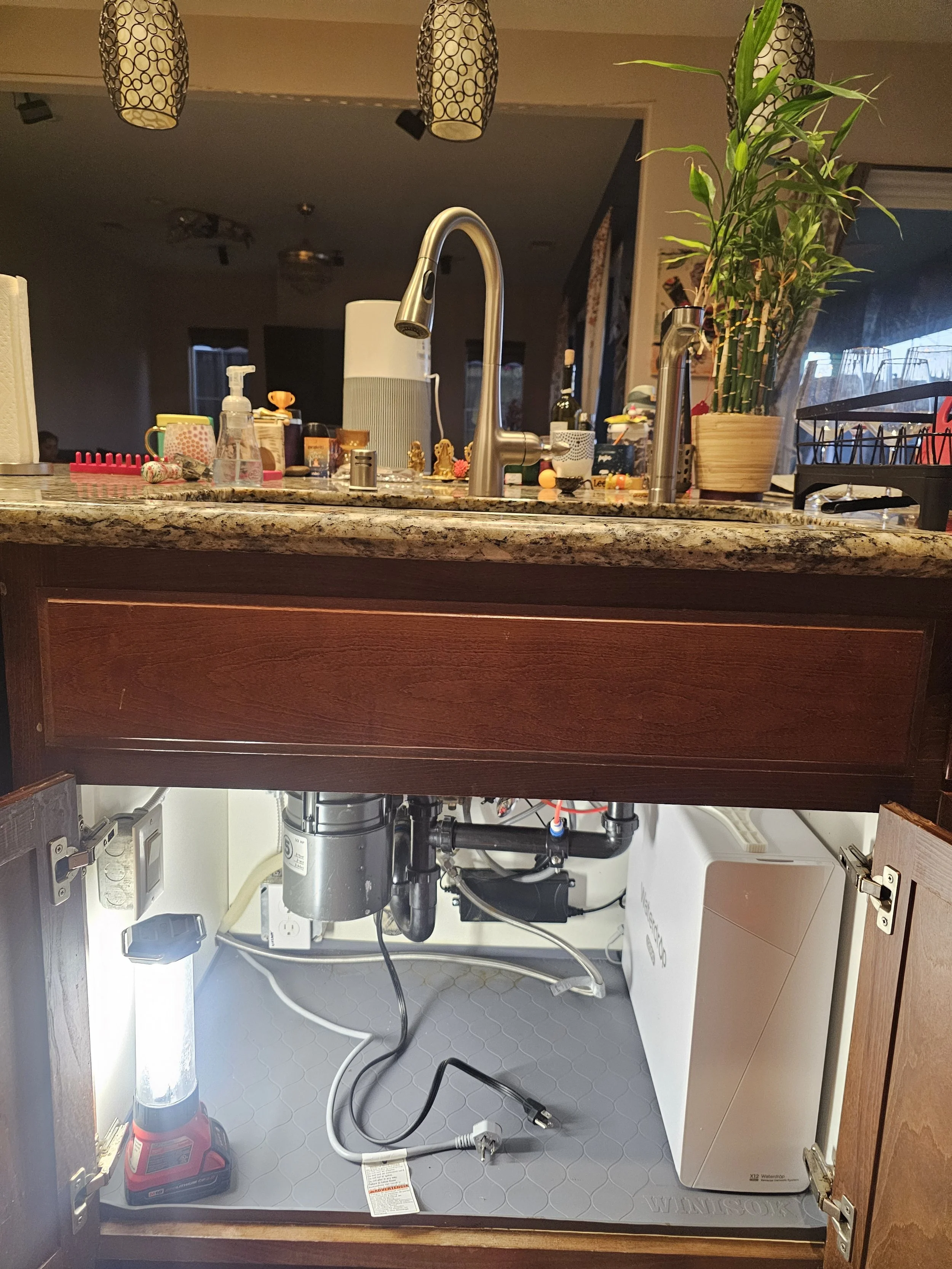 Completed under-sink plumbing and garbage disposal repair by Emerald Systems, restoring proper function and clean system setup in an East Bay home kitchen.