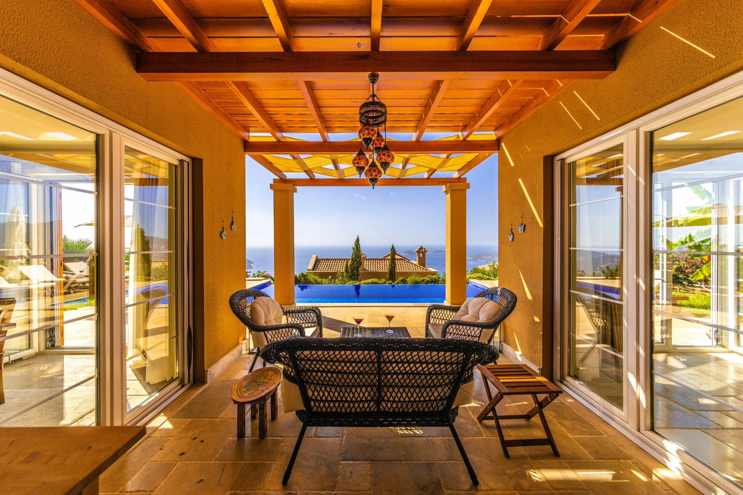 A candlelit terrace table for two at a luxury boutique hotel overlooking the Mediterranean Sea in Spain