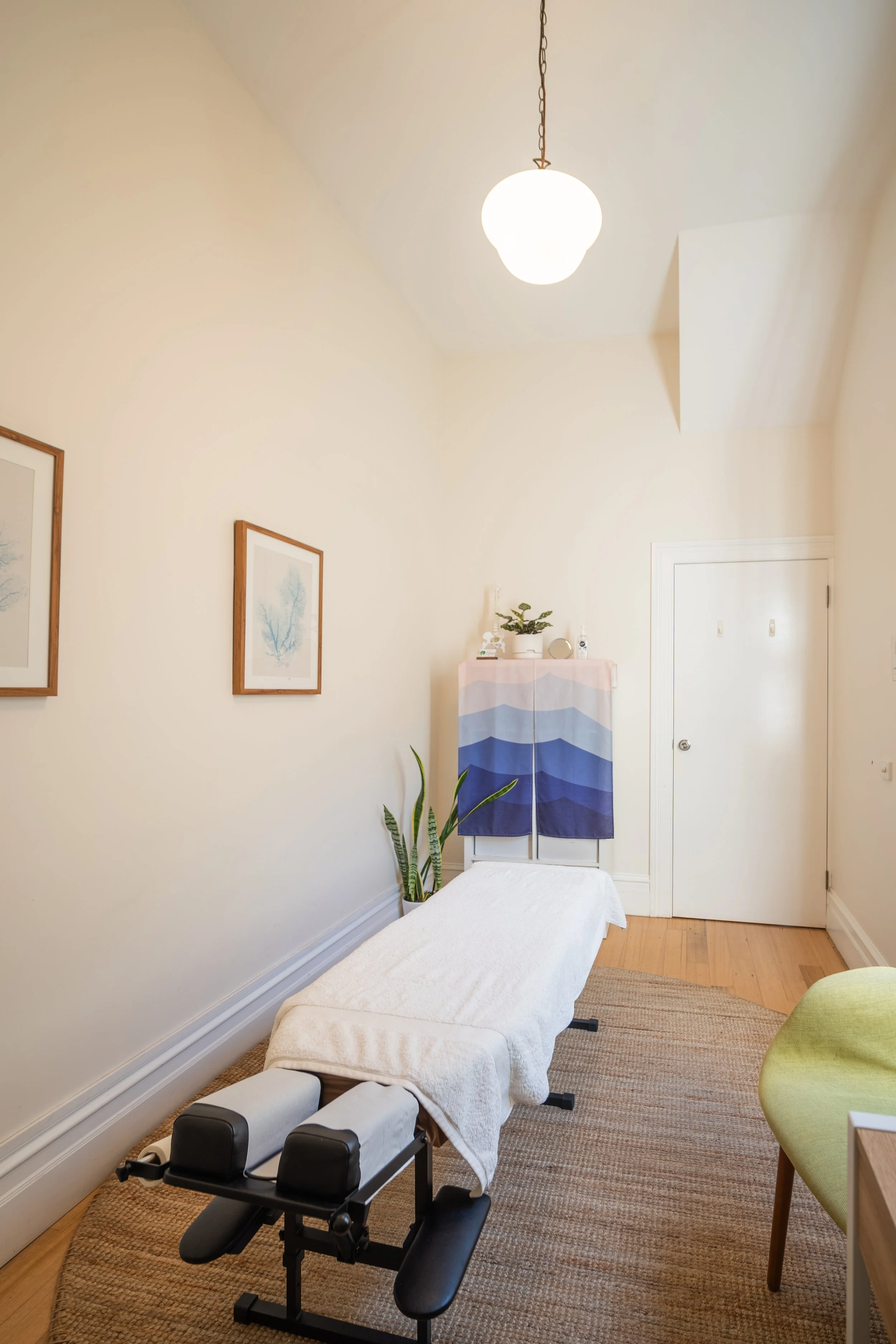 Clean minimal therapy room with treatment table at Four Seasons Wellness Centre Abbotsford Melbourne
