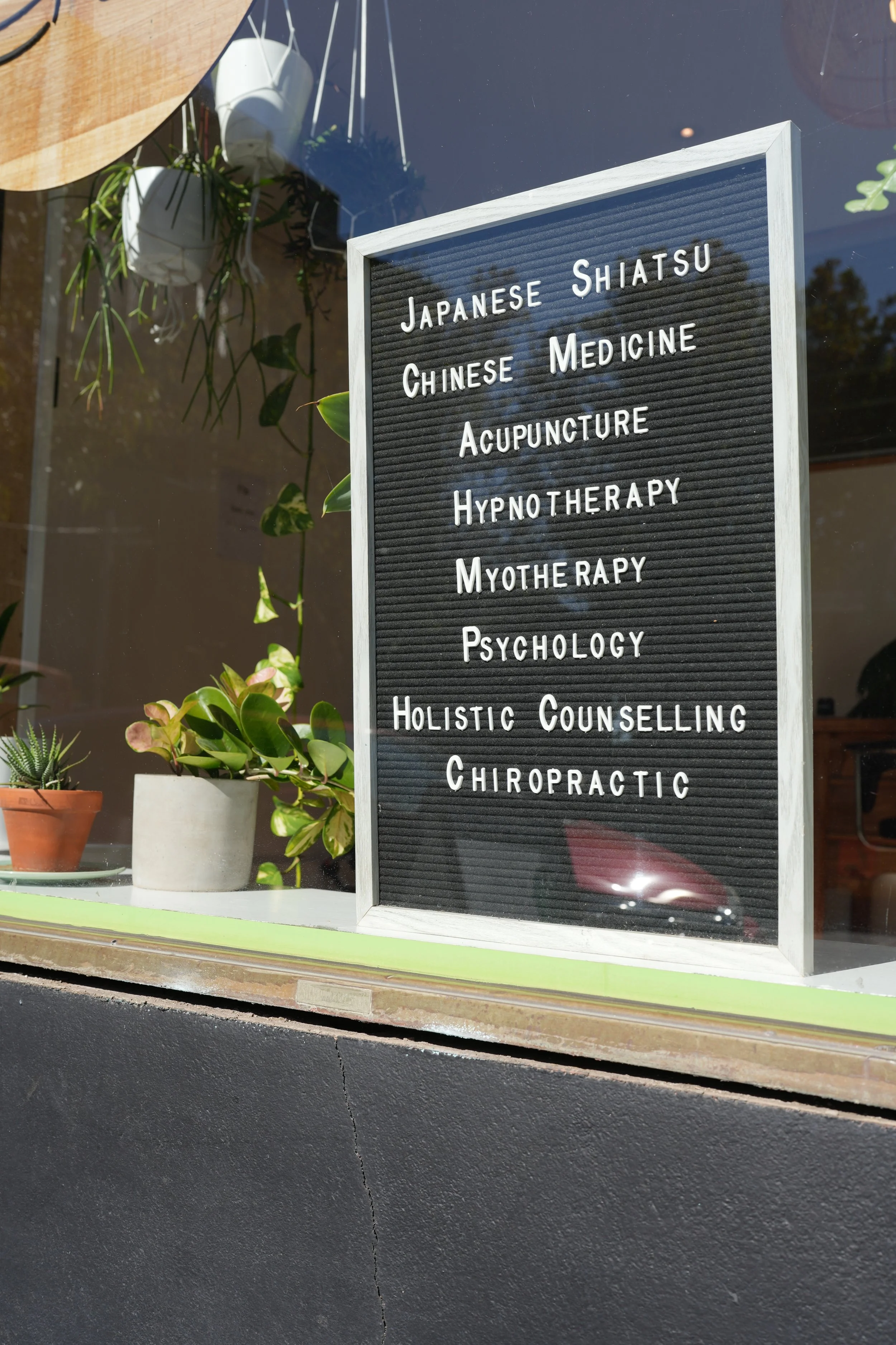 Outdoor signage and services board at Four Seasons Wellness Centre Abbotsford Melbourne