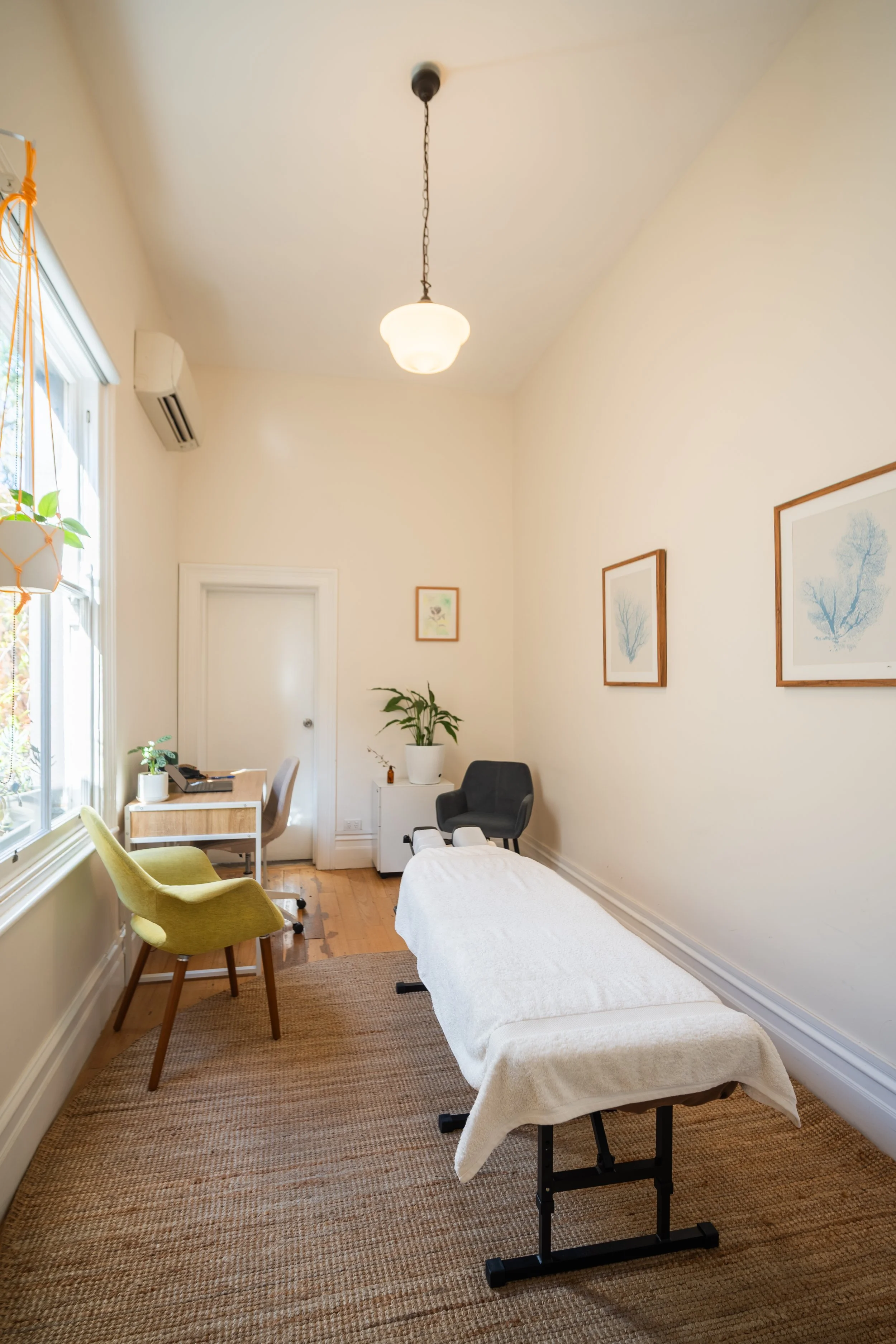 Peaceful therapy room with natural light and treatment table at Four Seasons Wellness Centre, Abbotsford Melbourne