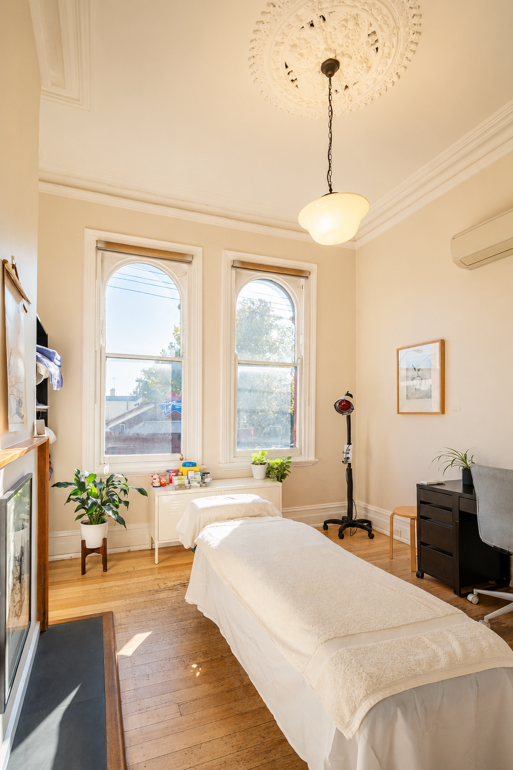 Natural light treatment room with massage table at Four Seasons Wellness Centre Abbotsford Melbourne