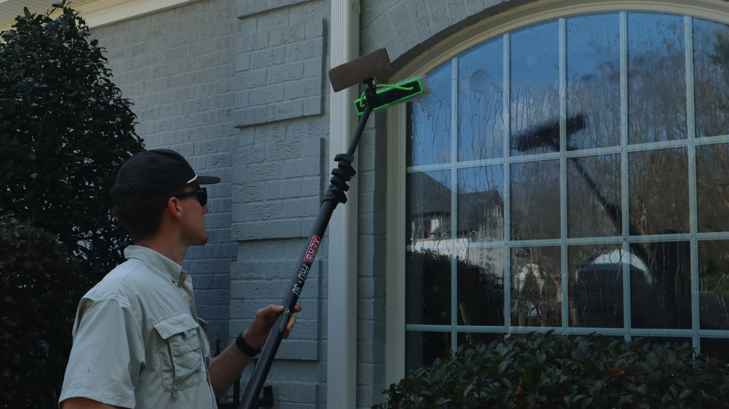 a person spotless cleaning exterior windows 