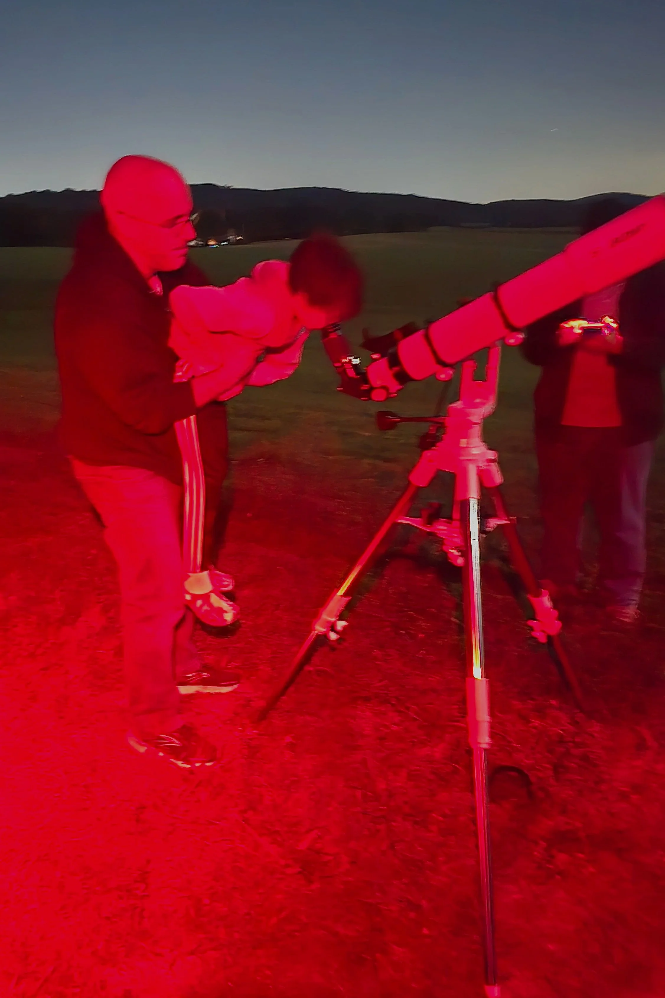 Father giving his son Ben a lift to see the moon at Naylor Observatory