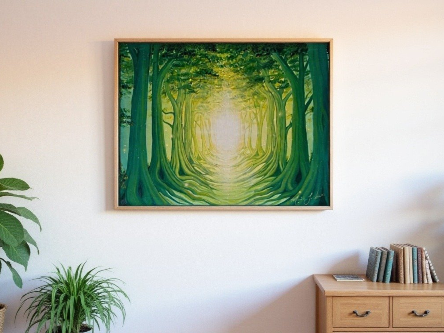 Painting of a green forest with a pathway leading into the distance, framed and hung on a white wall, with indoor house plants and a wood furniture. Nature artwork for neutral modern home décor. Woodsy artwork. Nature dreamscapes. Inspiring art.