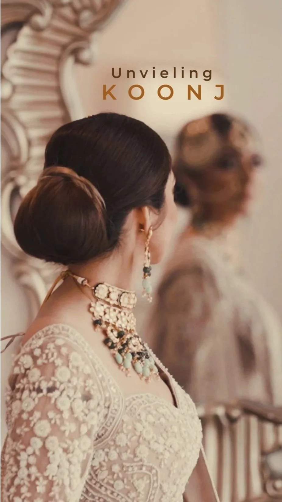 Bride looking into mirror wearing bridal necklace and traditional jewelry styled for pre-wedding look.