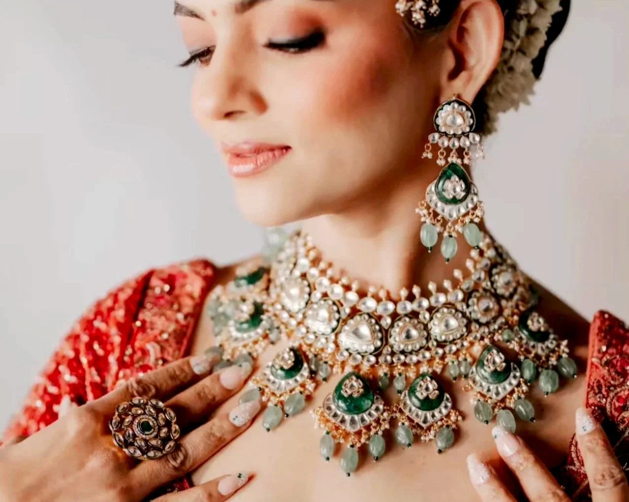 Handcrafted polki and kundan bridal jewelry set designed by Lazzevar, featuring a statement choker necklace, matching earrings, and head jewelry for Indian weddings