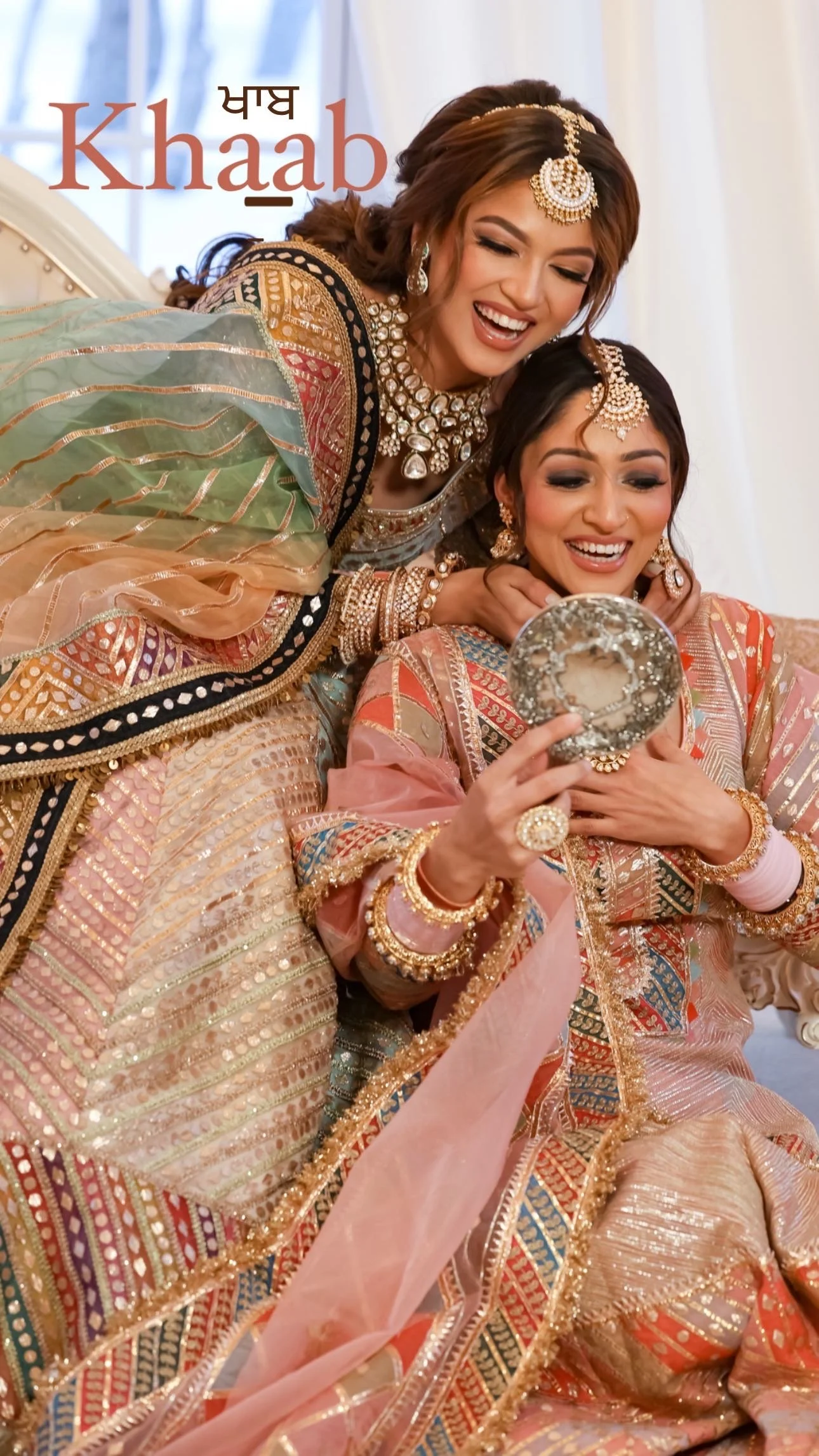 Bride sharing an emotional pre-wedding moment with her sister while wearing kundan bridal jewelry and traditional outfit.