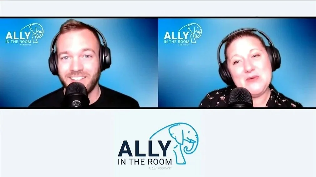 Two people on a podcast called 'Ally in the Room,' each wearing headphones and speaking into microphones, with a blue background and the podcast logo visible. Derek Herman is the co-host, he is a communications executive.