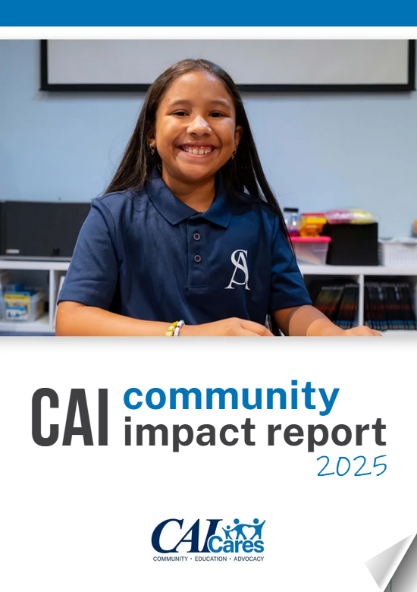 Cover page of a community impact report 2025 with a smiling young girl sitting at a desk in a classroom.