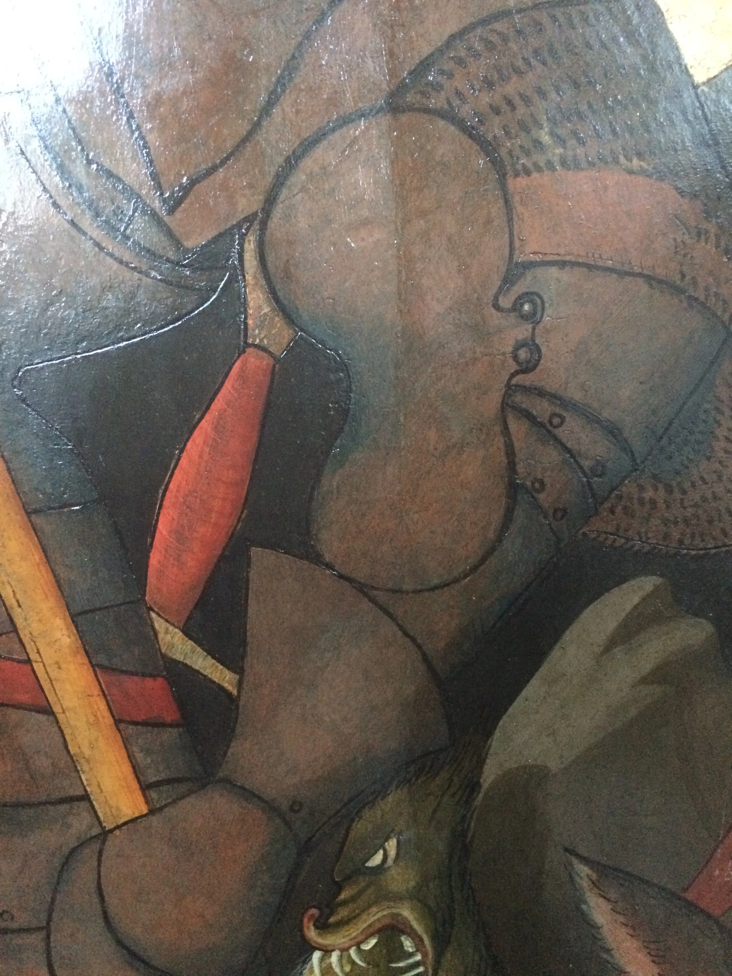 Detail of silver leaf armor in 15th century panel painting after cleaning and inpainting