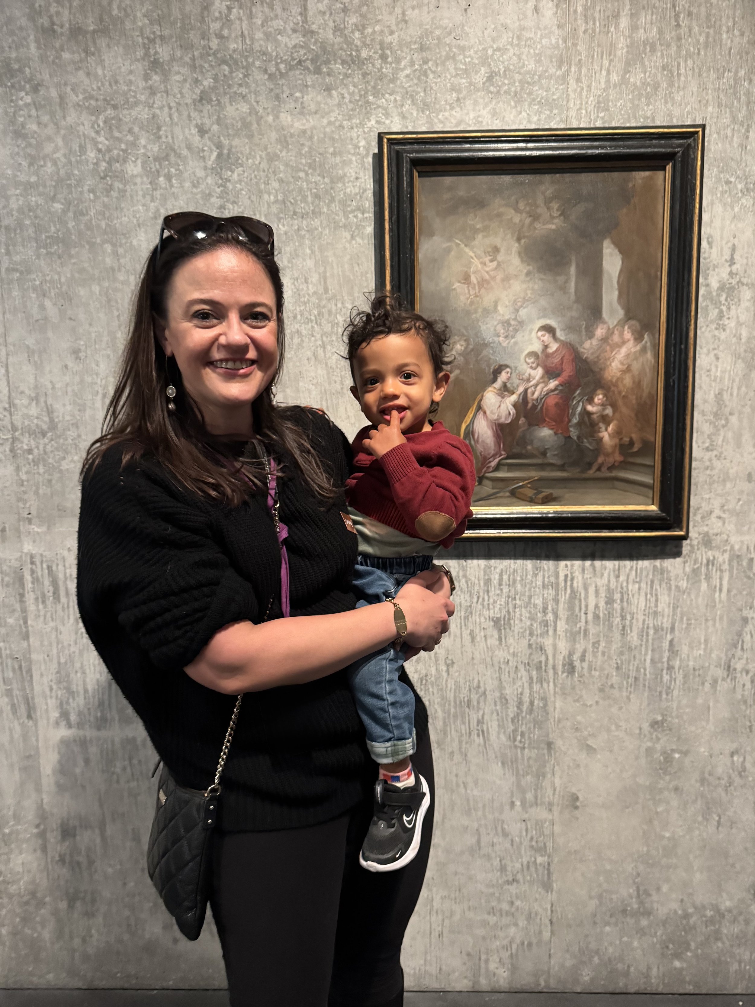 Miranda and her son in front of  Murillo she restored at LACMA