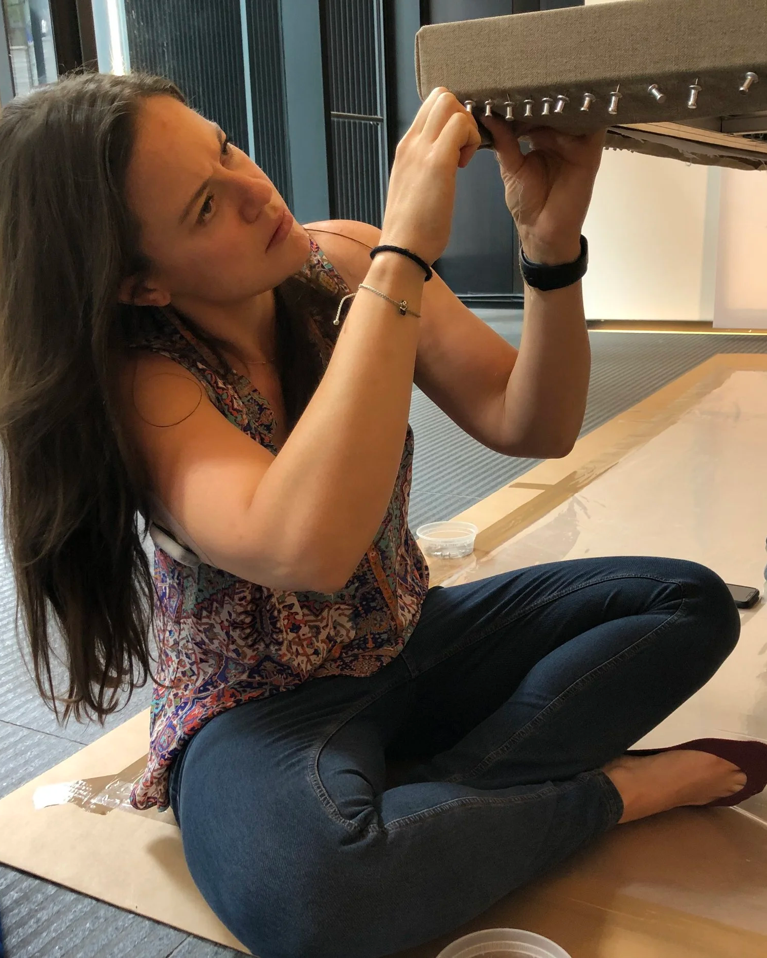 Miranda stretching an oversized painting