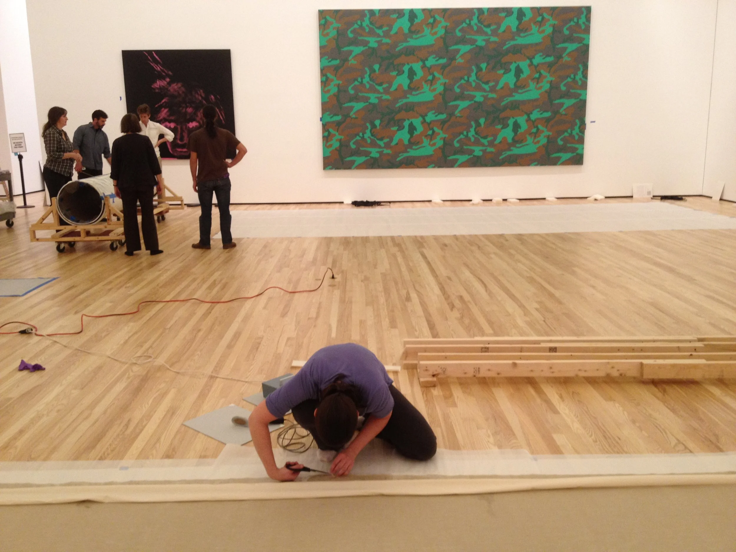strip lining a large scale painting by Andy Warhol