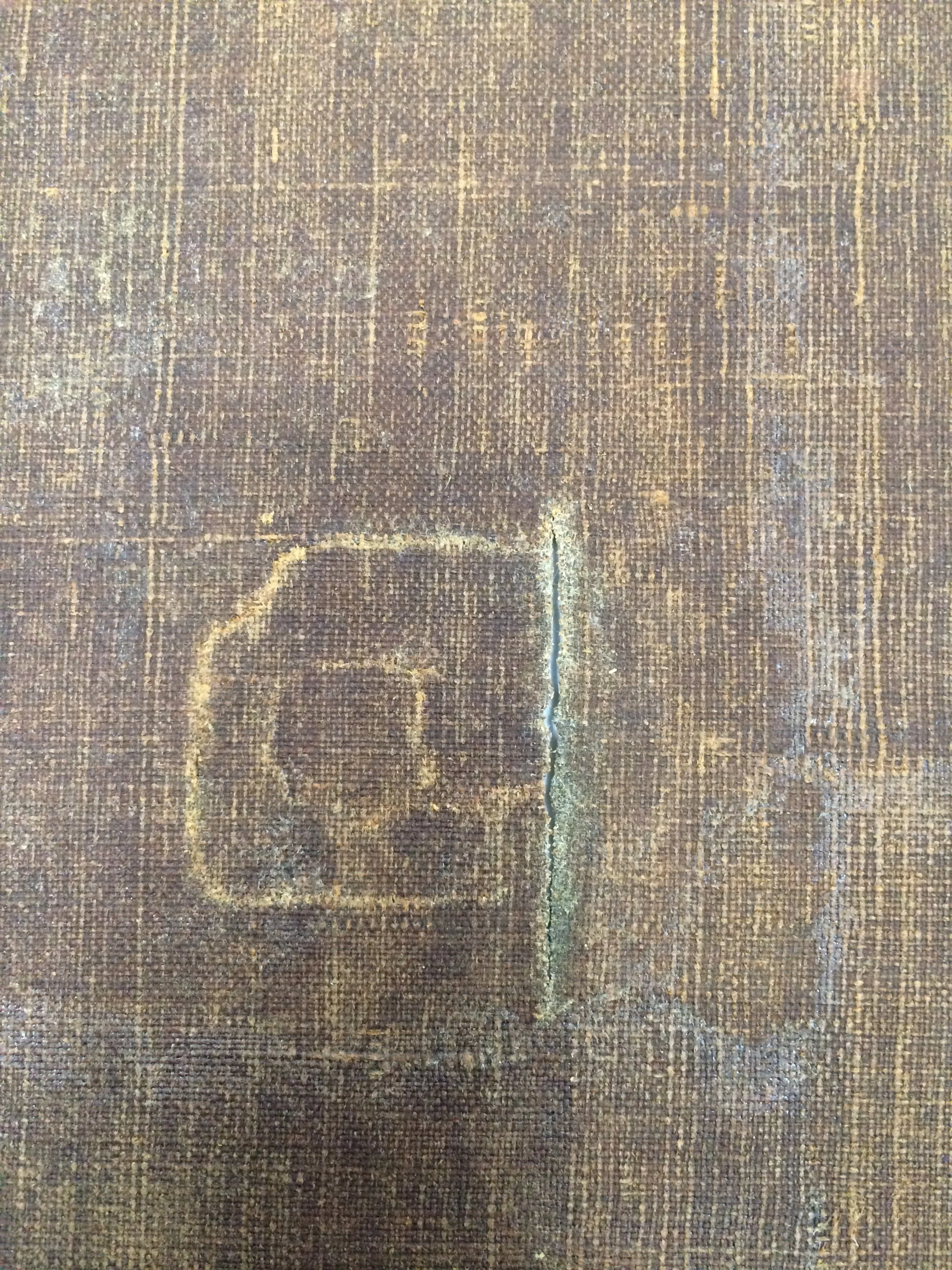 Tear in canvas viewed from the verso