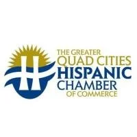Logo of the Greater Quad Cities Hispanic Chamber of Commerce with a stylized sun and wave design.