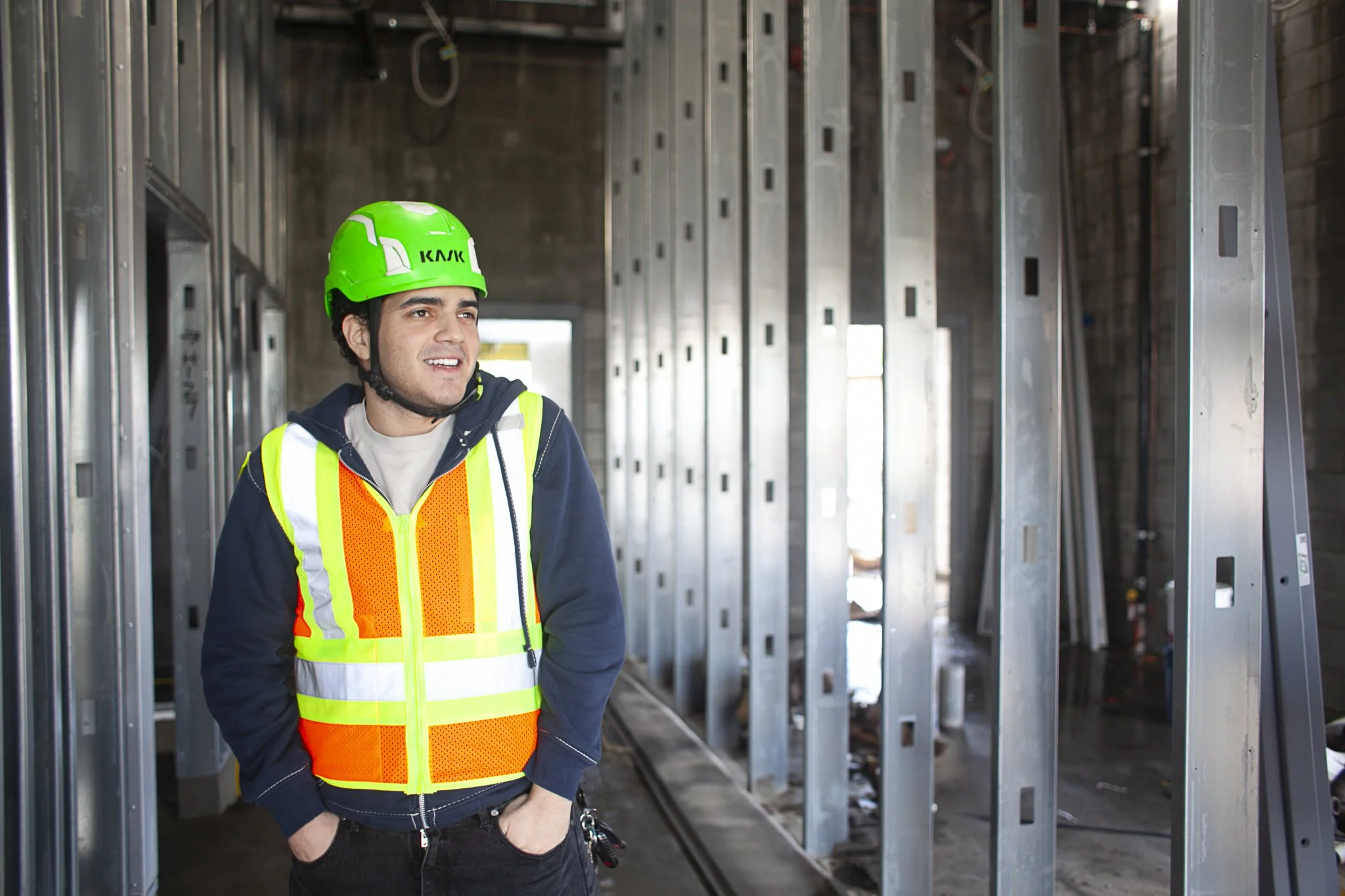 Intern field worker on the job site wearing safety gear.