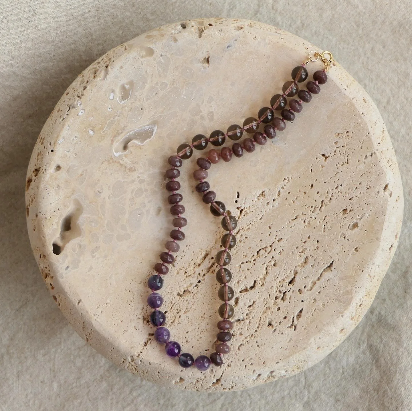 Smoky quartz, purple aventurine, and fluorite with silk and 14k gold