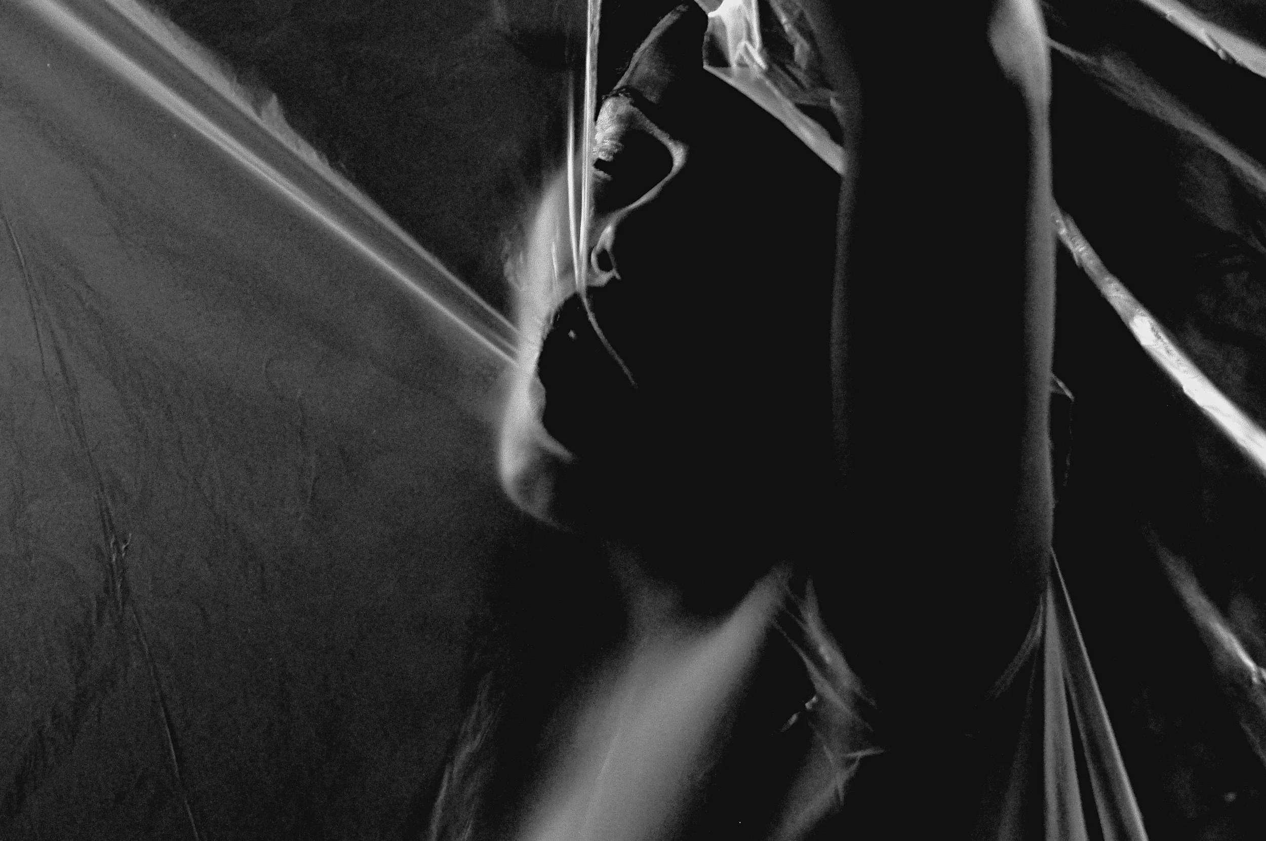 Black and white photo of a person playing the violin.