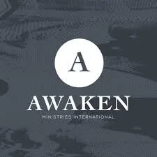 Logo for AWAKEN Ministries International with a large letter A inside a circle, set against a dark background.