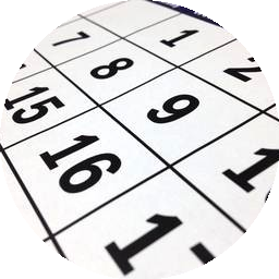 Close-up of a playing bingo card with numbered squares.