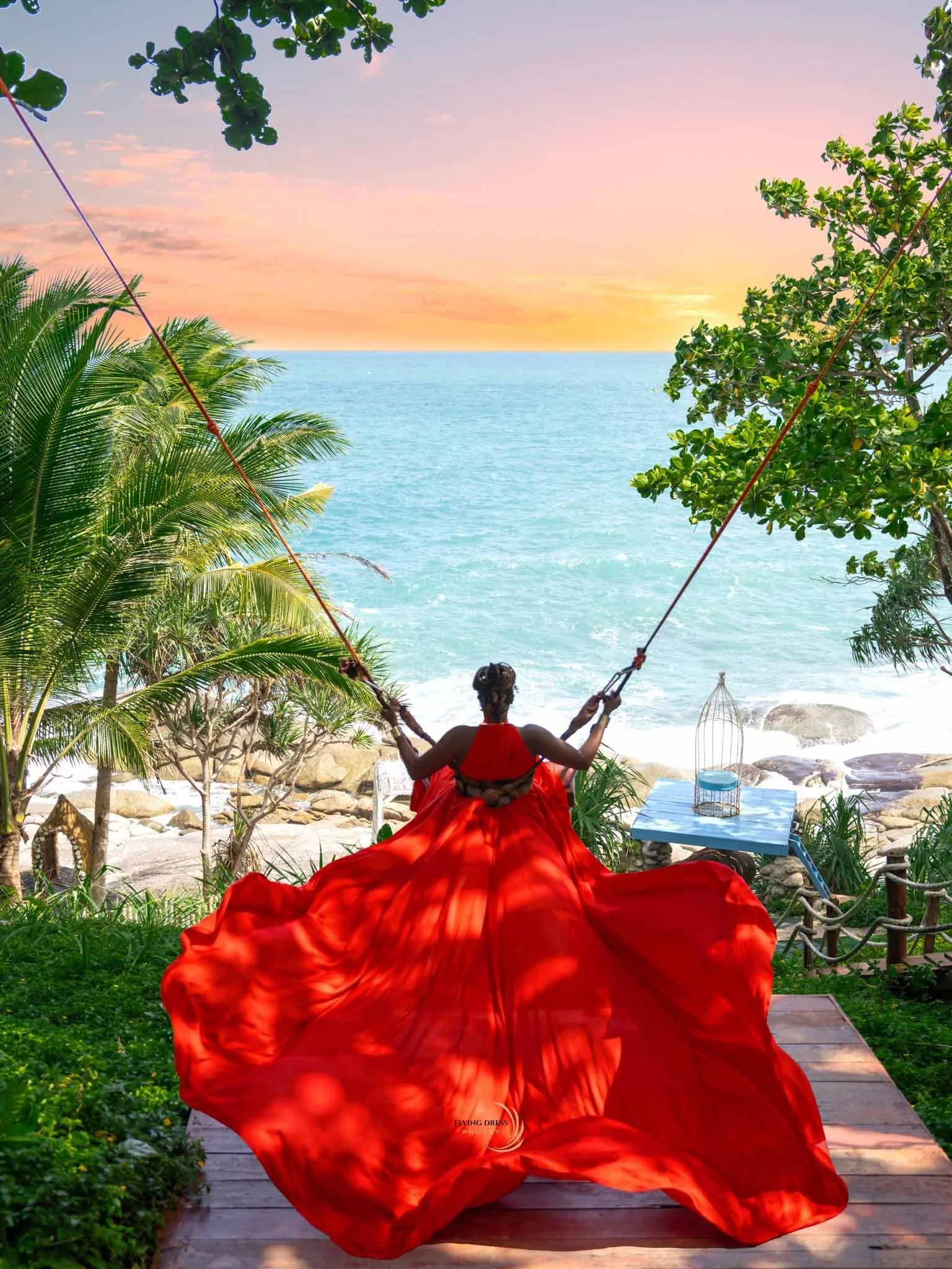 red-flying-dress-swing-overlooking-ocean-phuket.jpg