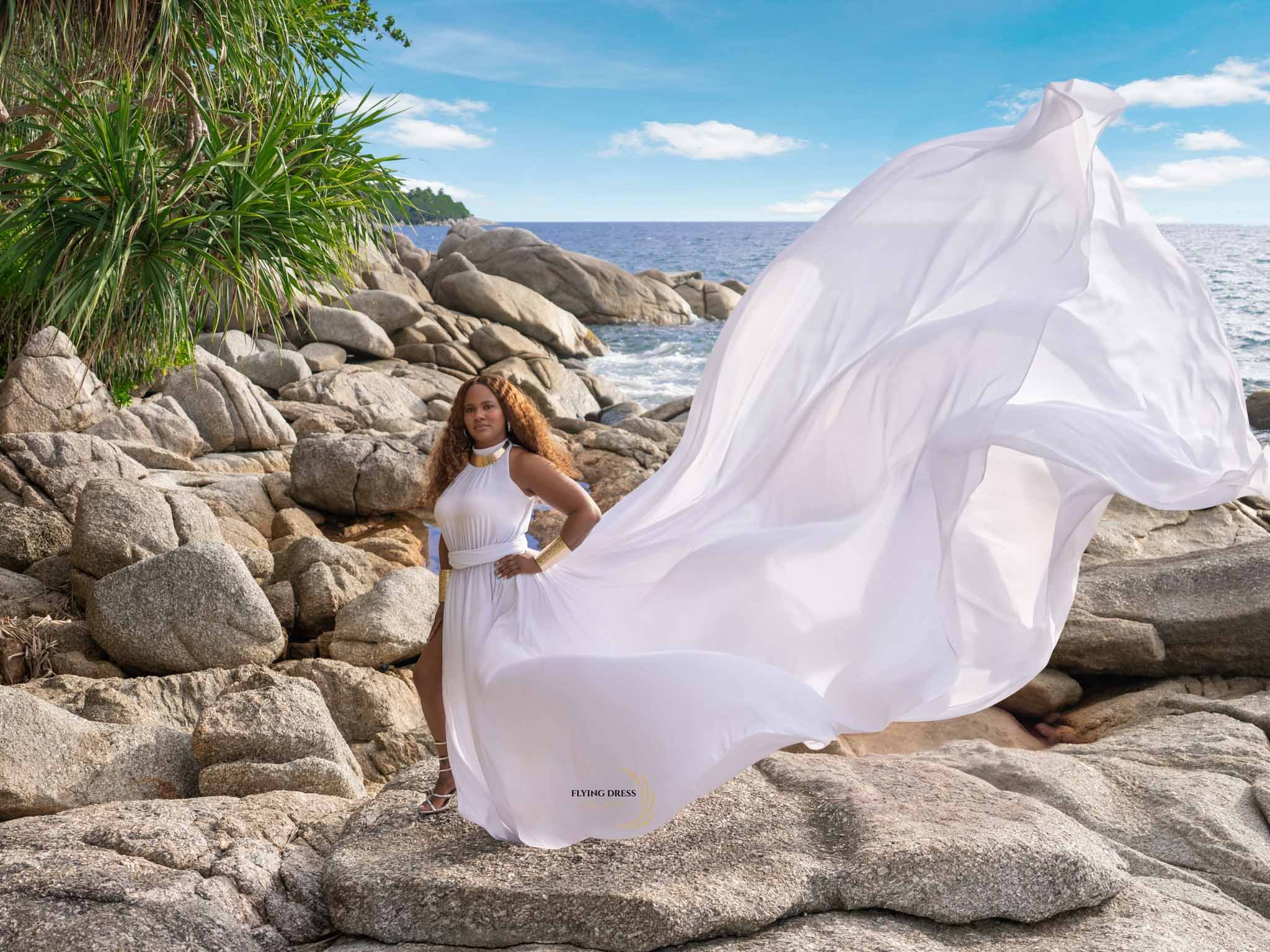 white-flying-dress-rocks-sunset-phuket.jpg