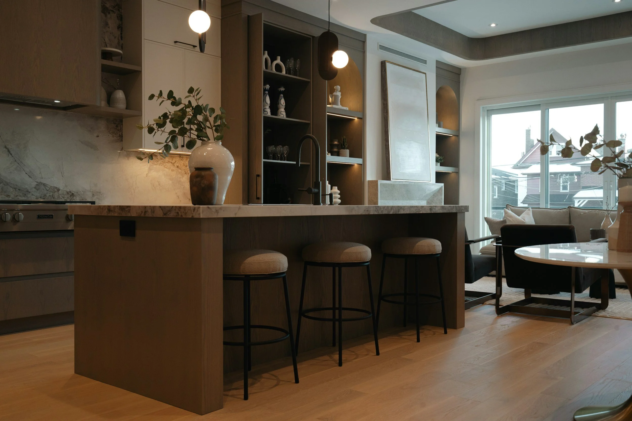 Open-concept kitchen and living space in a New Orleans residential investment property, showcasing design-driven renovation and value-add potential.
