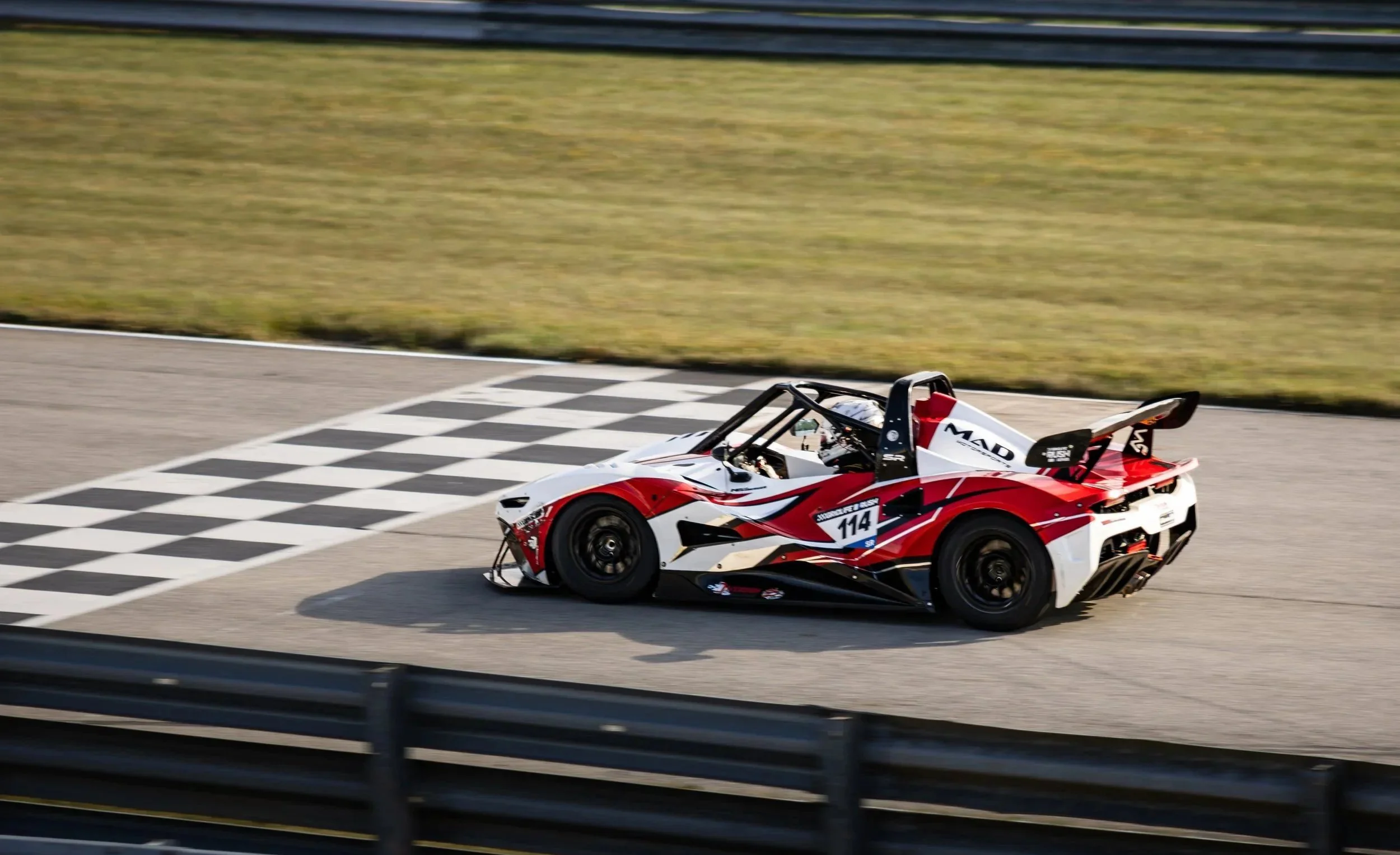 A Rush SR crossing the finish line at Gridlife Chicago 2026, captured by Samantha Blair