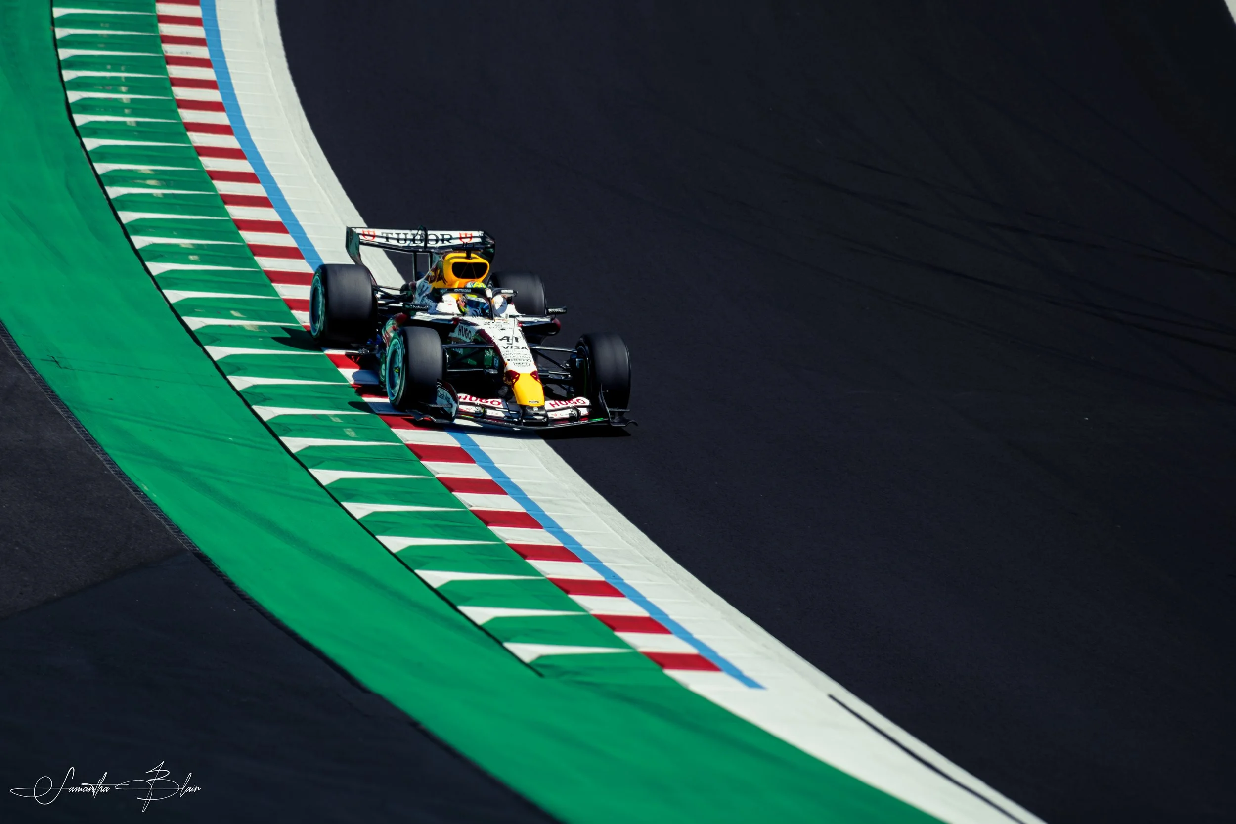 VCARB 2026 Formula 1 Car taking Suzuka's Spoon Curve, captured by Samantha Blair