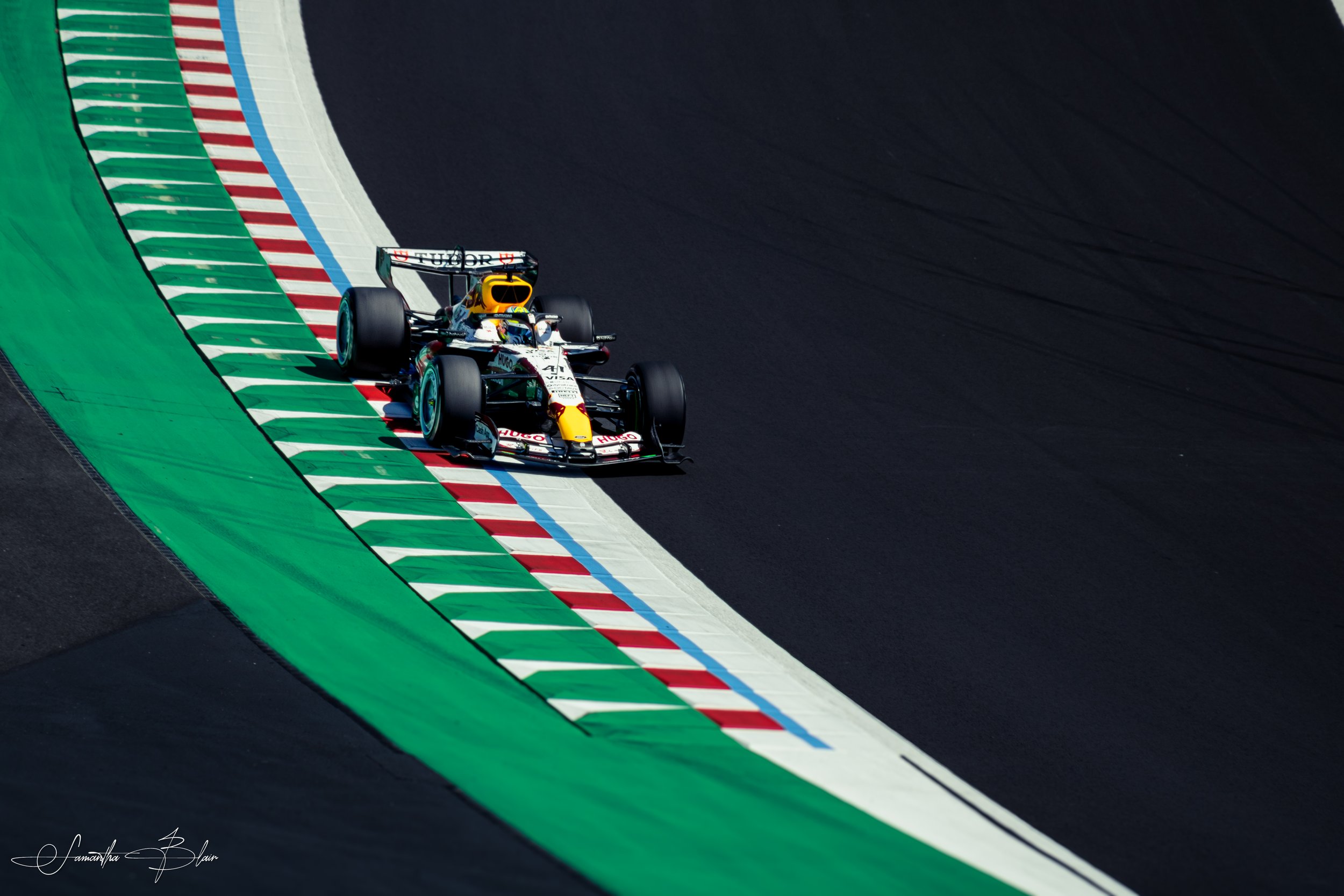 VCARB 2026 F1 Car going through the spoon at Suzuka