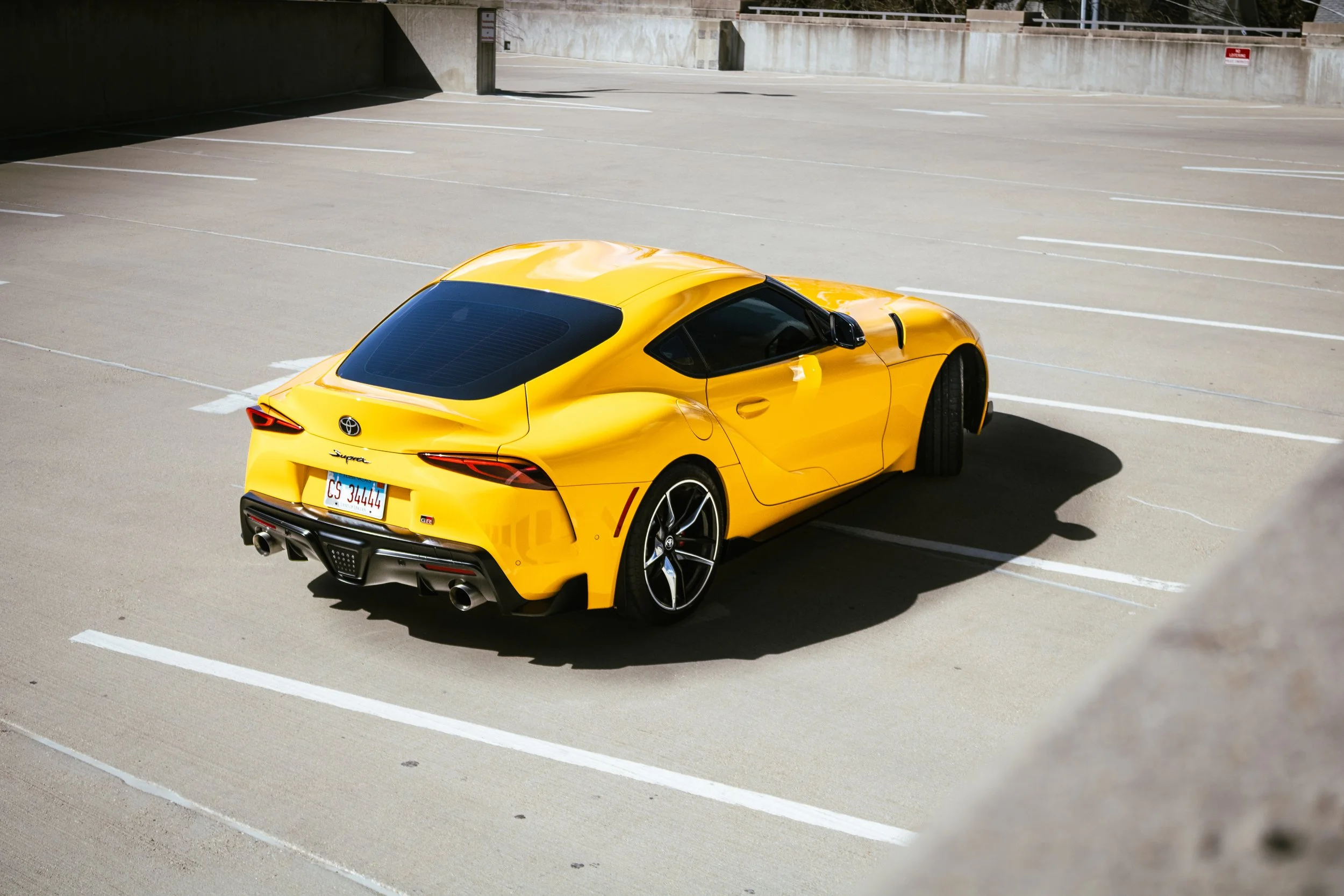 A top angle of a 2022 Toyota Supra in a parking garage, captured by Samantha Blair