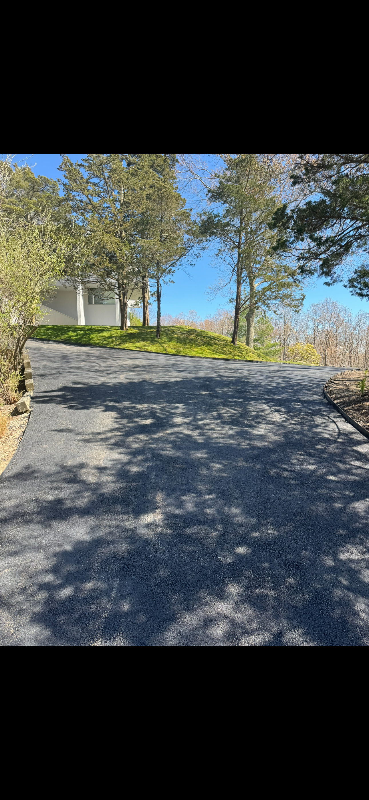 An aerial view of a house with solar panels installed