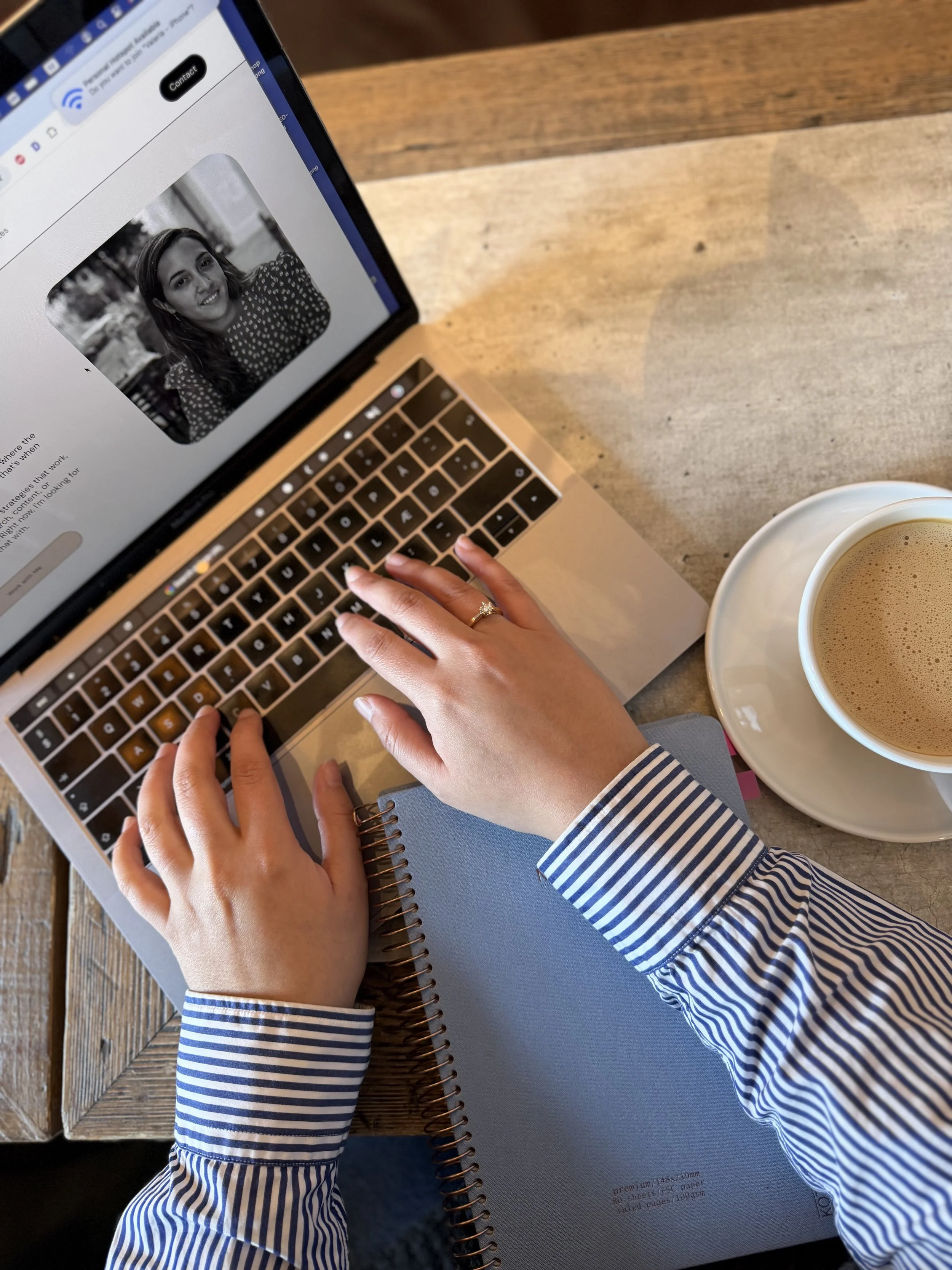 hands writing on a computer