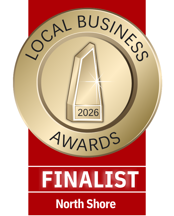2026 Local Business Awards Finalists for the North Shore. Gold medal with black text reading "Local Business Awards 2026" and a stylized building icon at the center. Below the medal, a red background with white text reading "FINALIST North Shore."