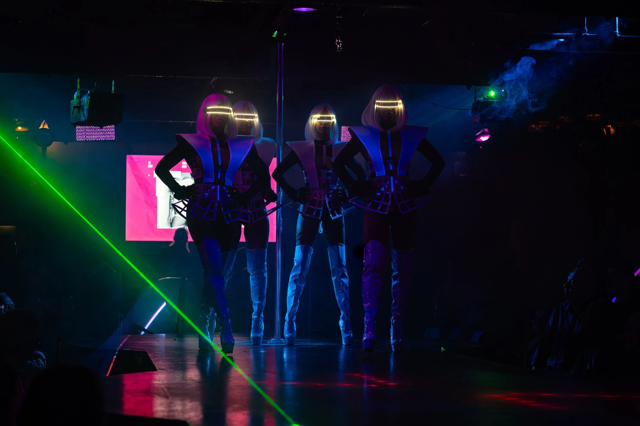 Laser light stage show with performers in futuristic costumes at The Men's Gallery Melbourne strip club