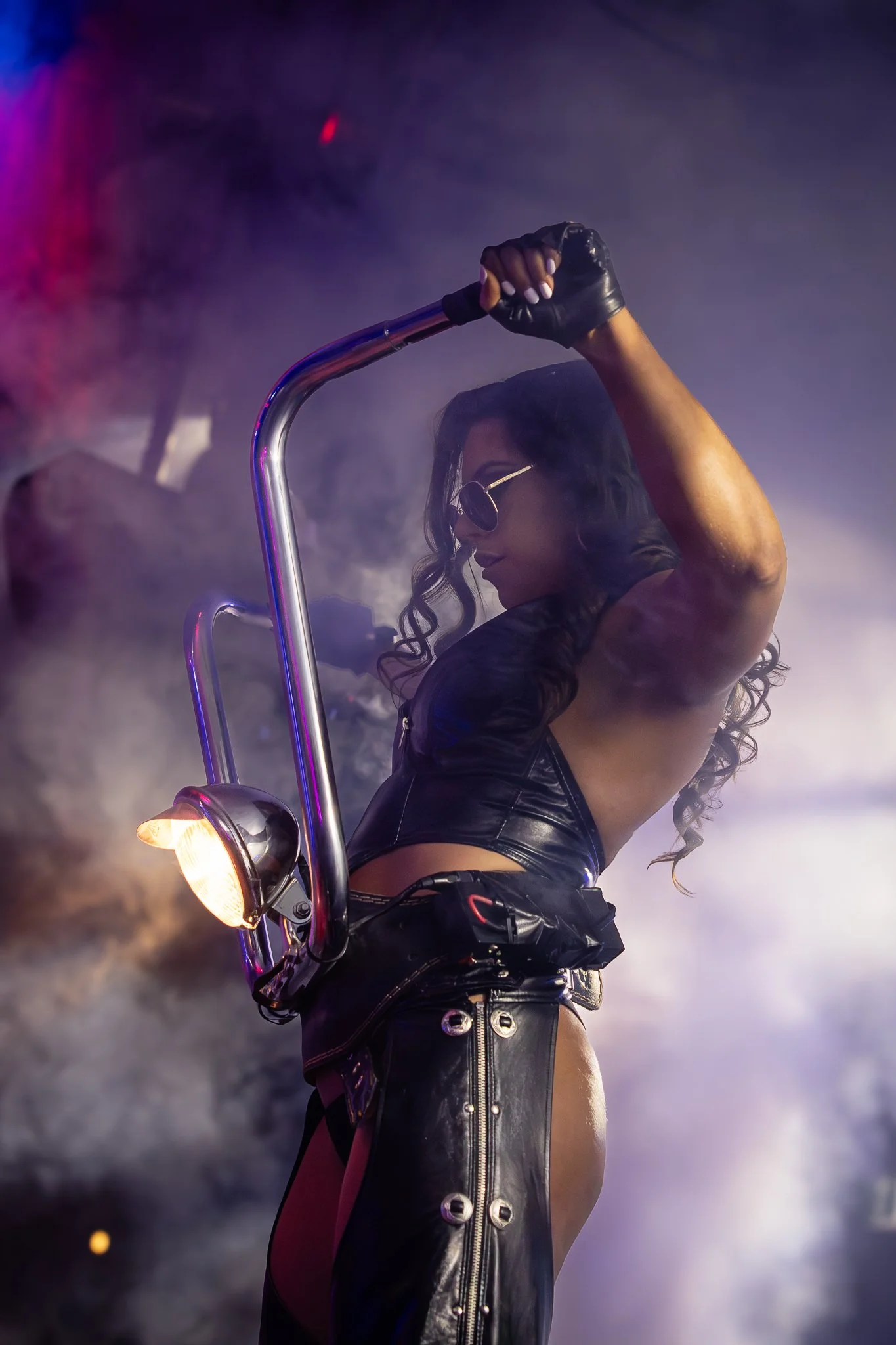Themed stage performer in leather costume during a feature show at The Men's Gallery Melbourne strip club