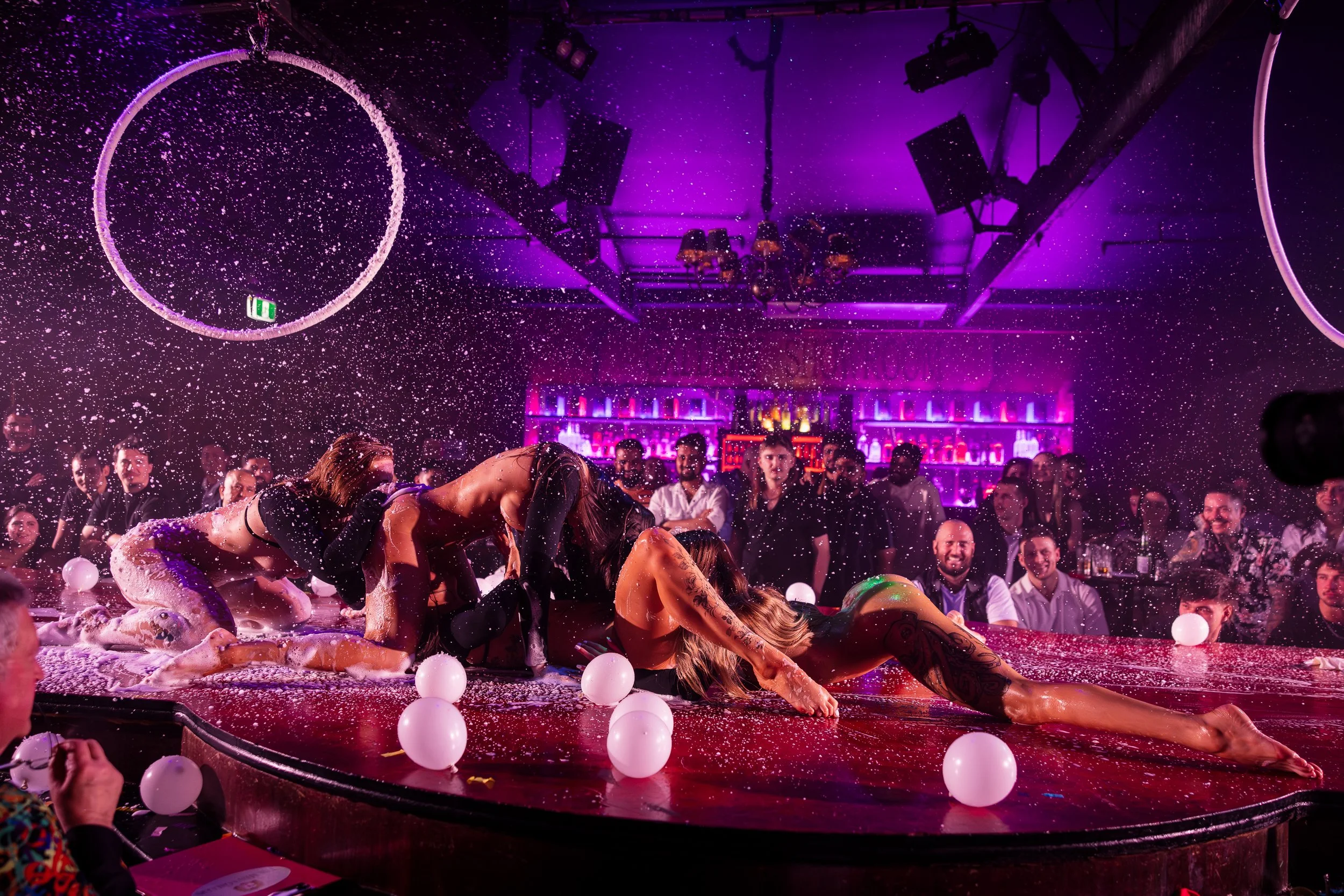Duo aerial hoop performers entertaining the audience at The Men's Gallery Melbourne strip club