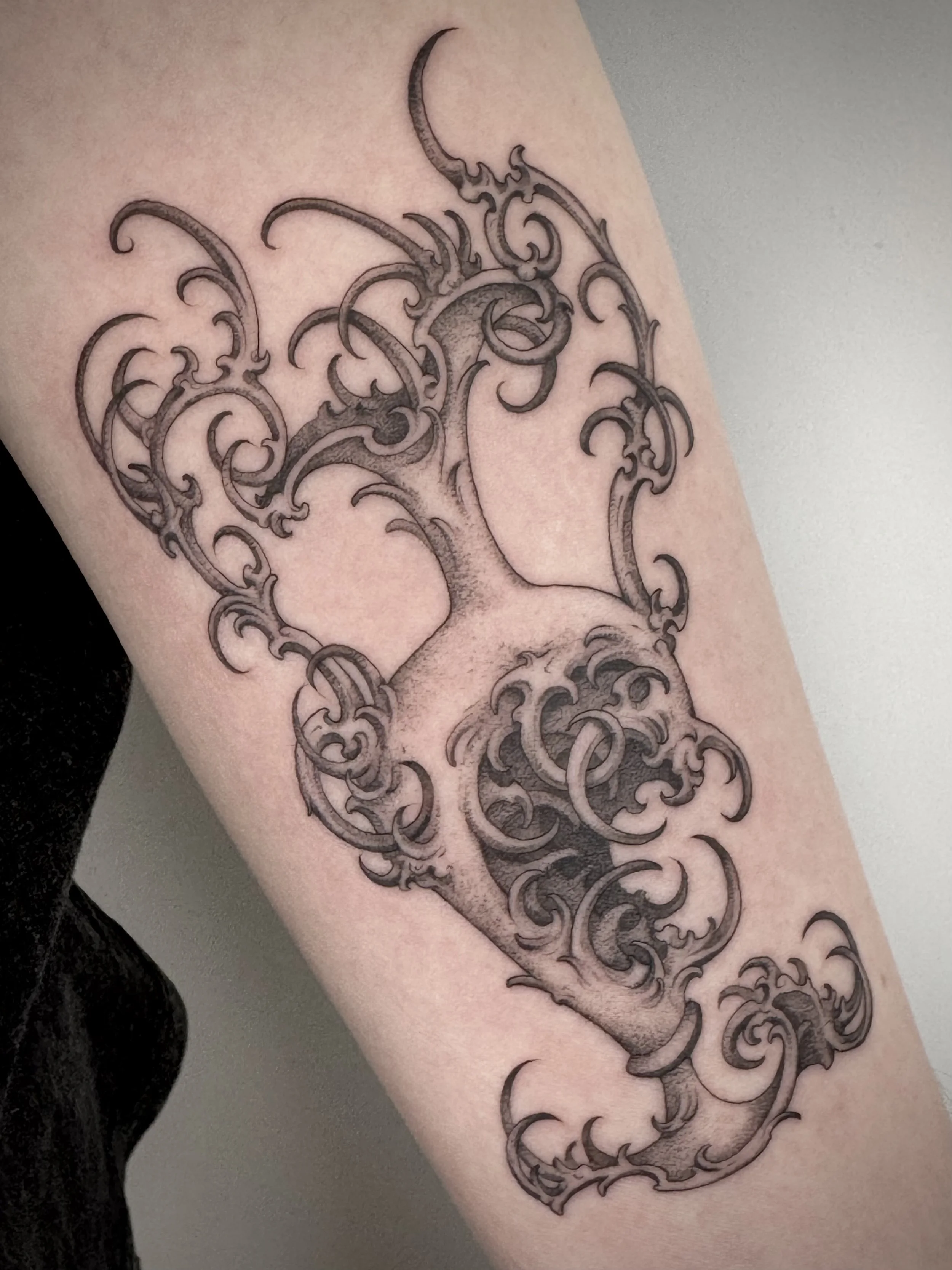 Fine line, black and grey tattoo by Eddy Lou of a decorative vase, inspired by her own ceramic work. Done at FLT Tattoo Studio in Newcastle NSW