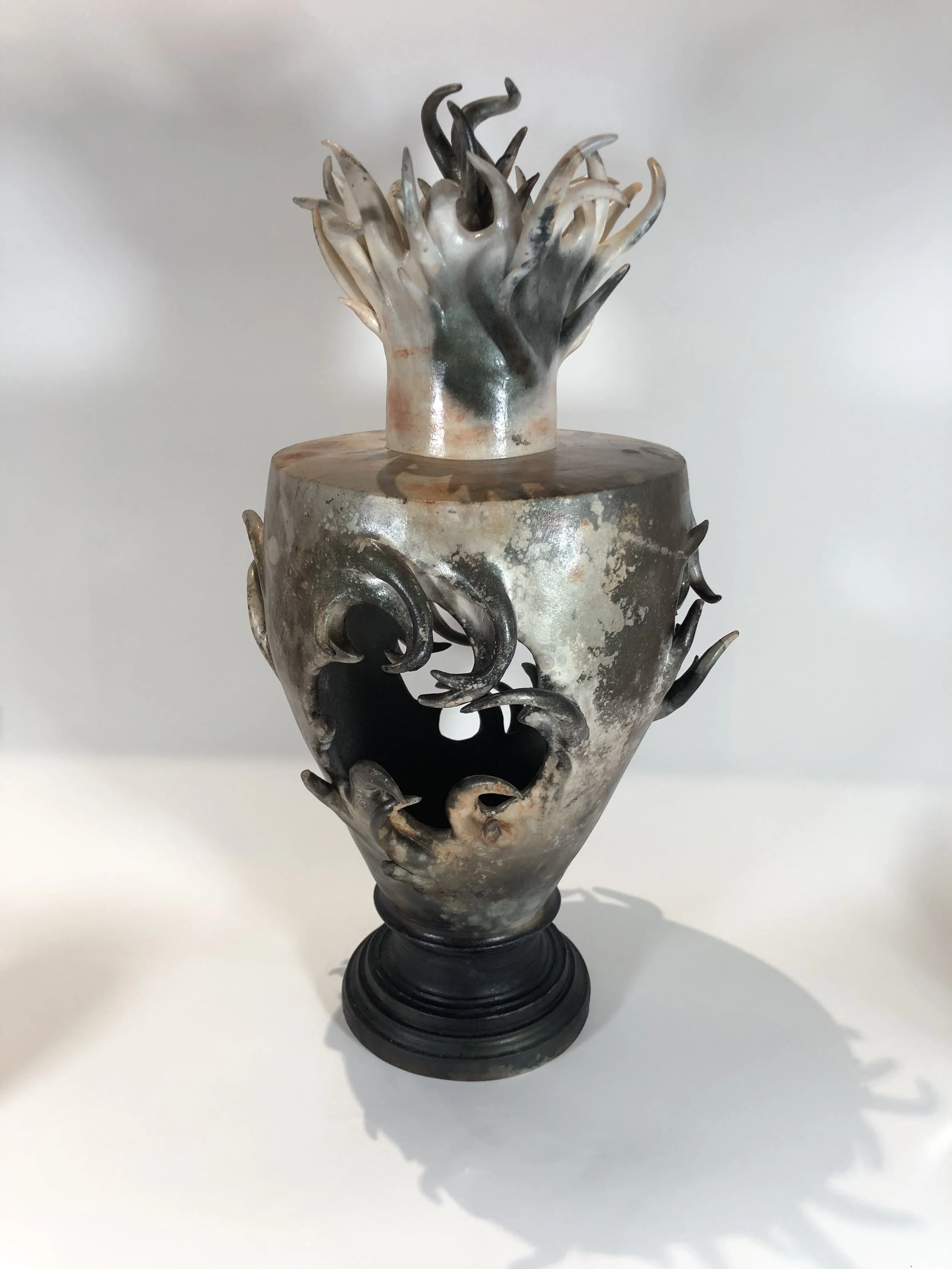 Handmade and saggar fired ceramic vessel by Eddy Lou