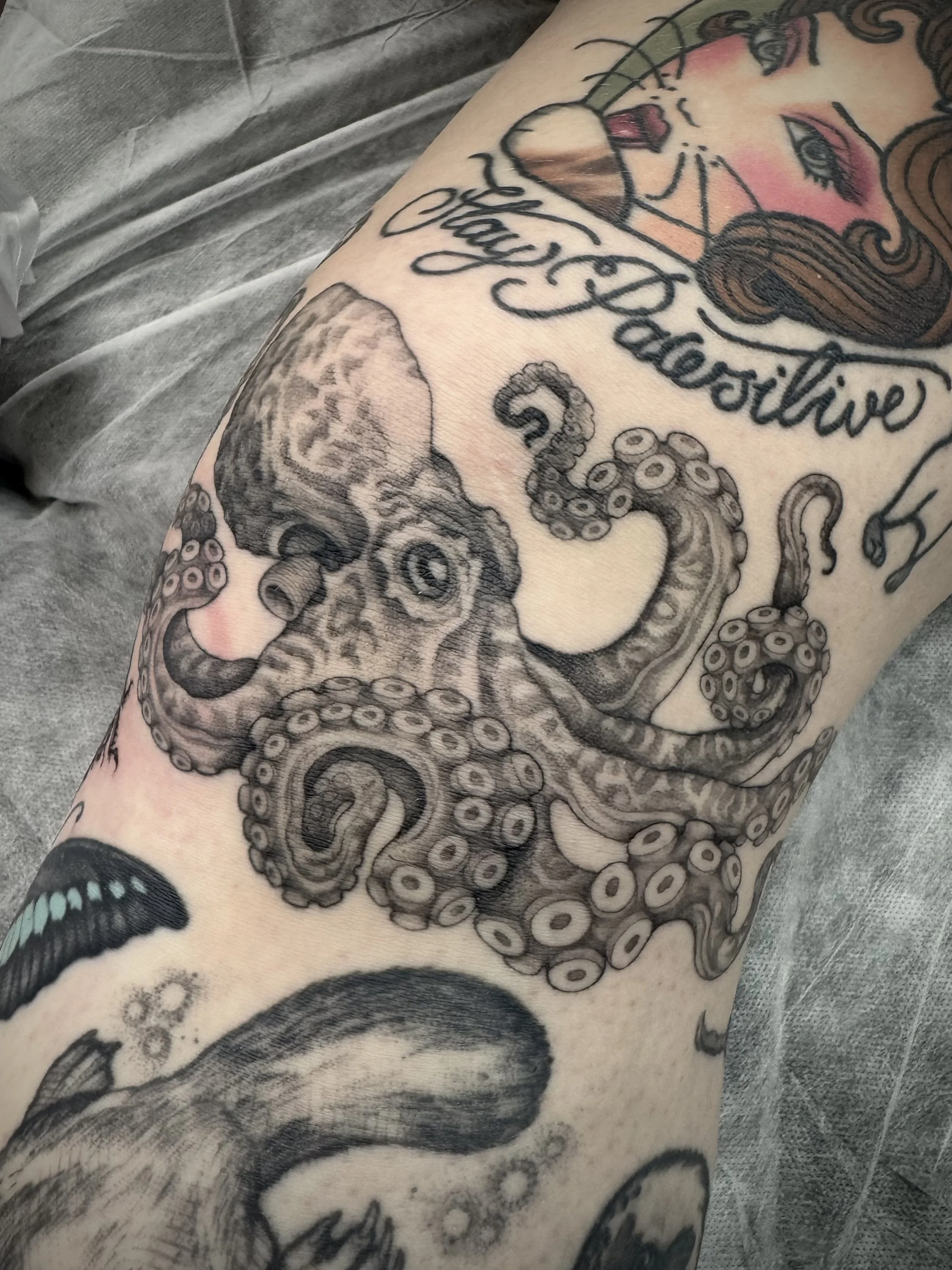 Healed and lived in Black and grey, fine line Octopus tattoo by Eddy Lou, done at FLT Tattoo Studio