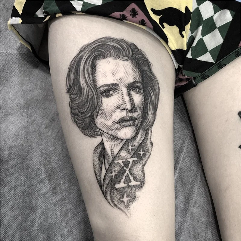 Fine line, black and grey, crosshatch portrait tattoo by Eddy Lou of Gillian Anderson as Agent Scully from X Files. Done at FLT Tattoo Studio in Newcastle NSW