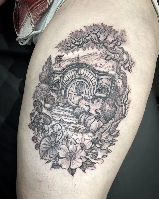 Fine line, black and grey tattoo by Eddy Lou of a a Hobbit Hole in Hobbiton from Lord of the Rings. Done at FLT Tattoo Studio in Newcastle NSW