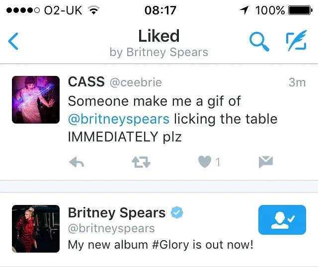 Twitter conversation with Britney Spears' verified account announcing her new album #Glory and a fan requesting a gif of Britney Spears licking the table.