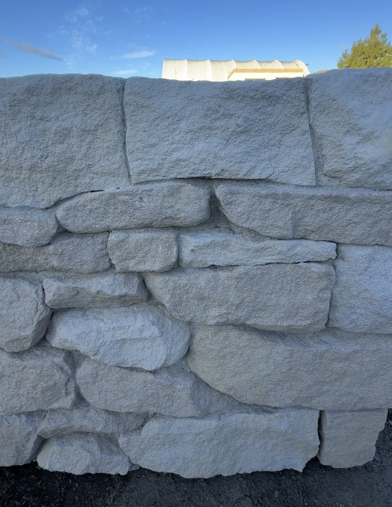 Freeform Southern Highlands sandstone walling with irregular natural pieces and warm Australian sandstone tones.