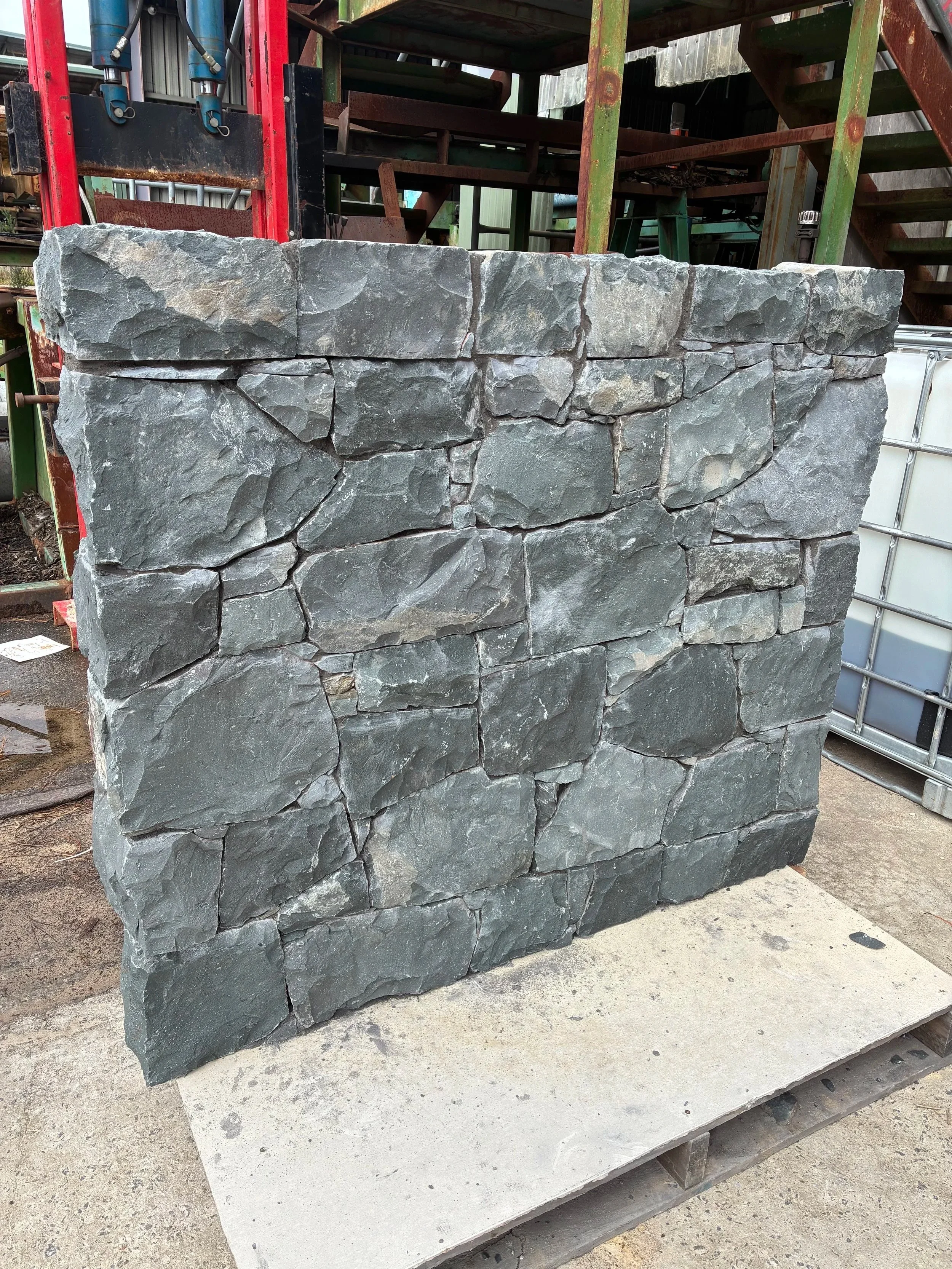 Bombo Bluestone walling stone showing dark blue-grey tones, rugged texture and natural Australian stone character.